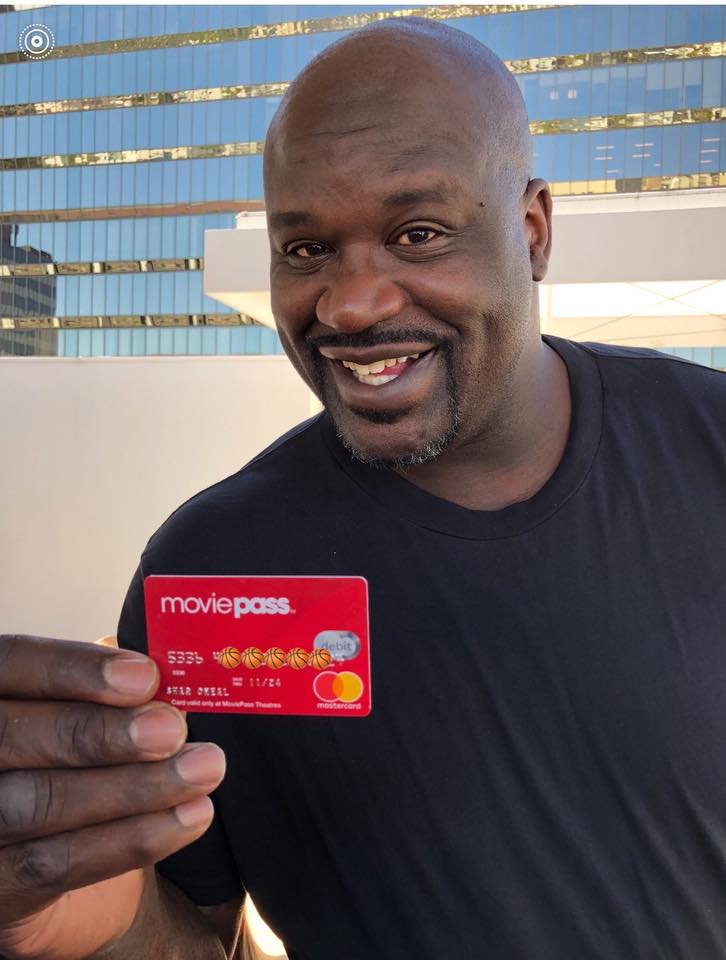 Shaq holding his MoviePass (aka the greatest invention ever