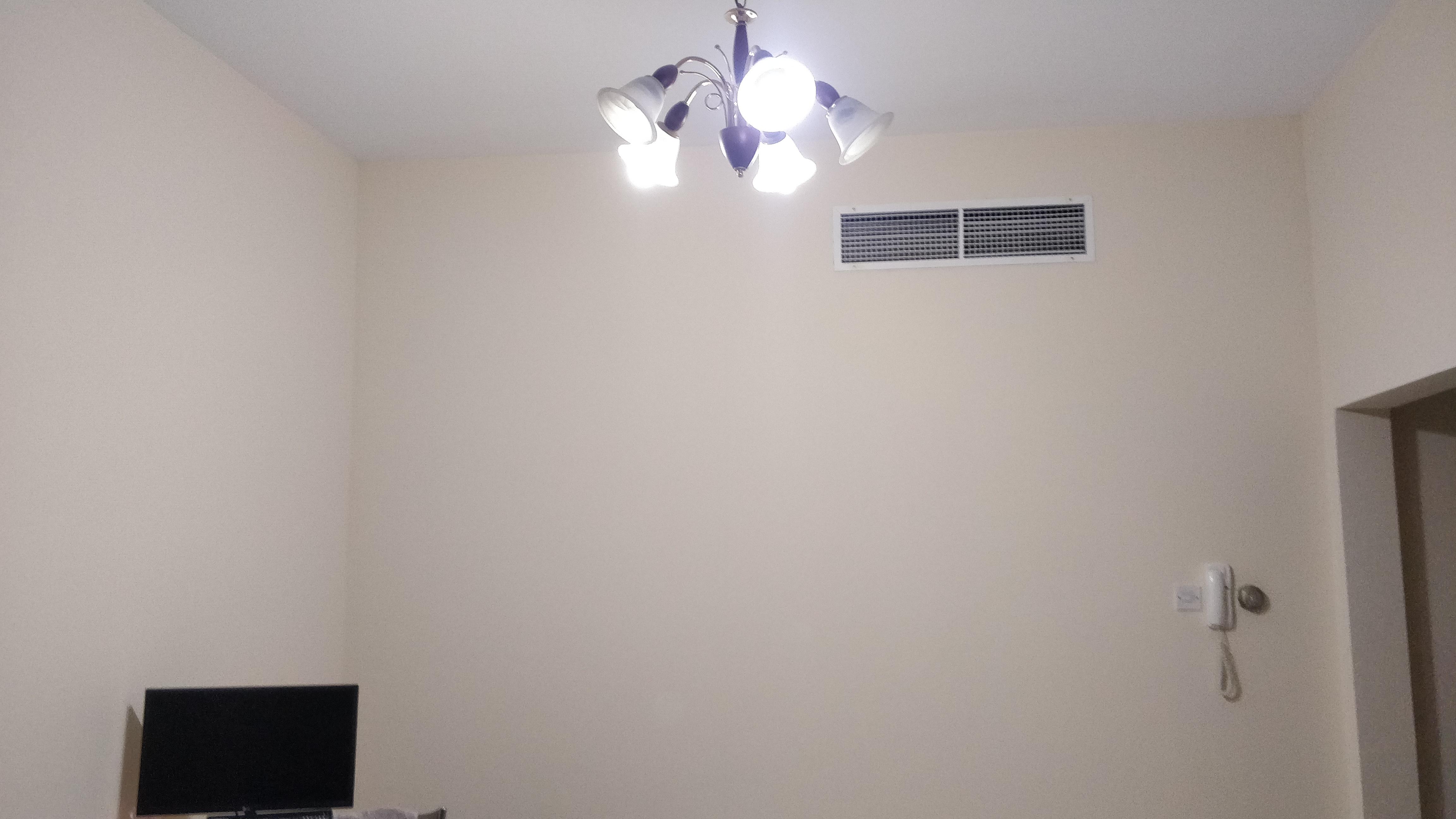 The plain white light is making my living room look dull. What can I do