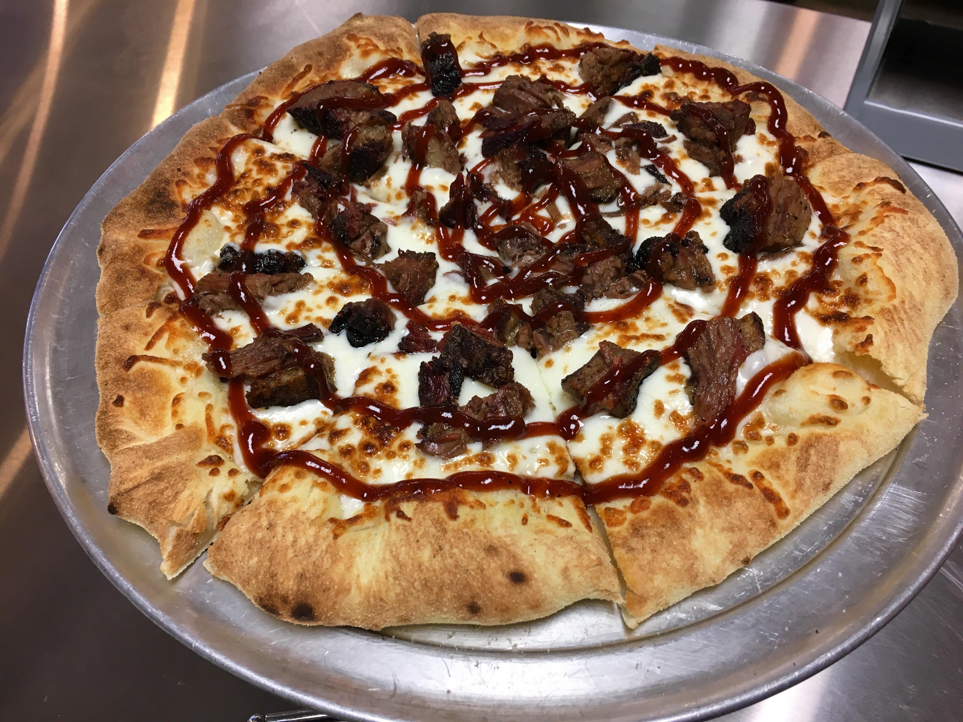 [Pro/Chef] Barbecue smoked brisket pizza on a thin crust, topped off