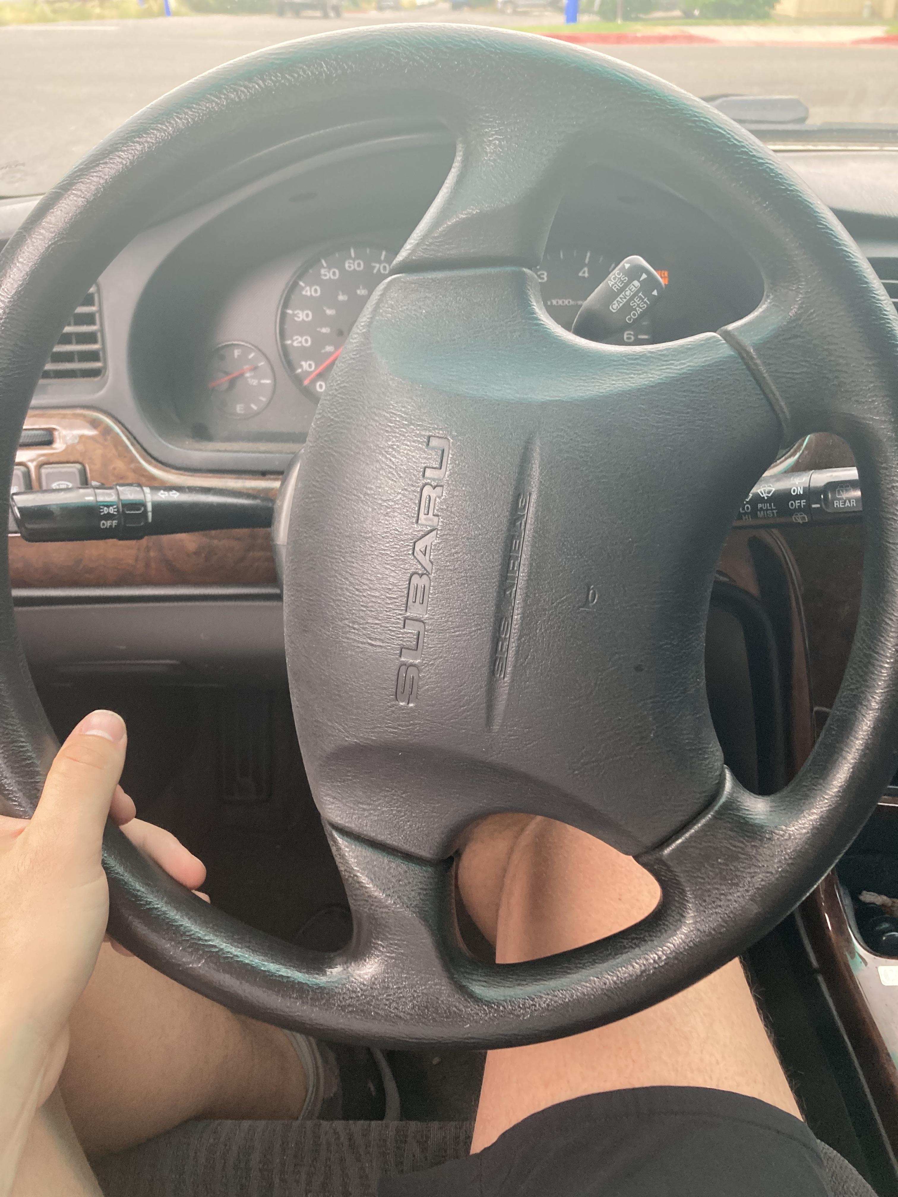 2000 Subaru Outback. If I turn the wheel before backing, I hear a click