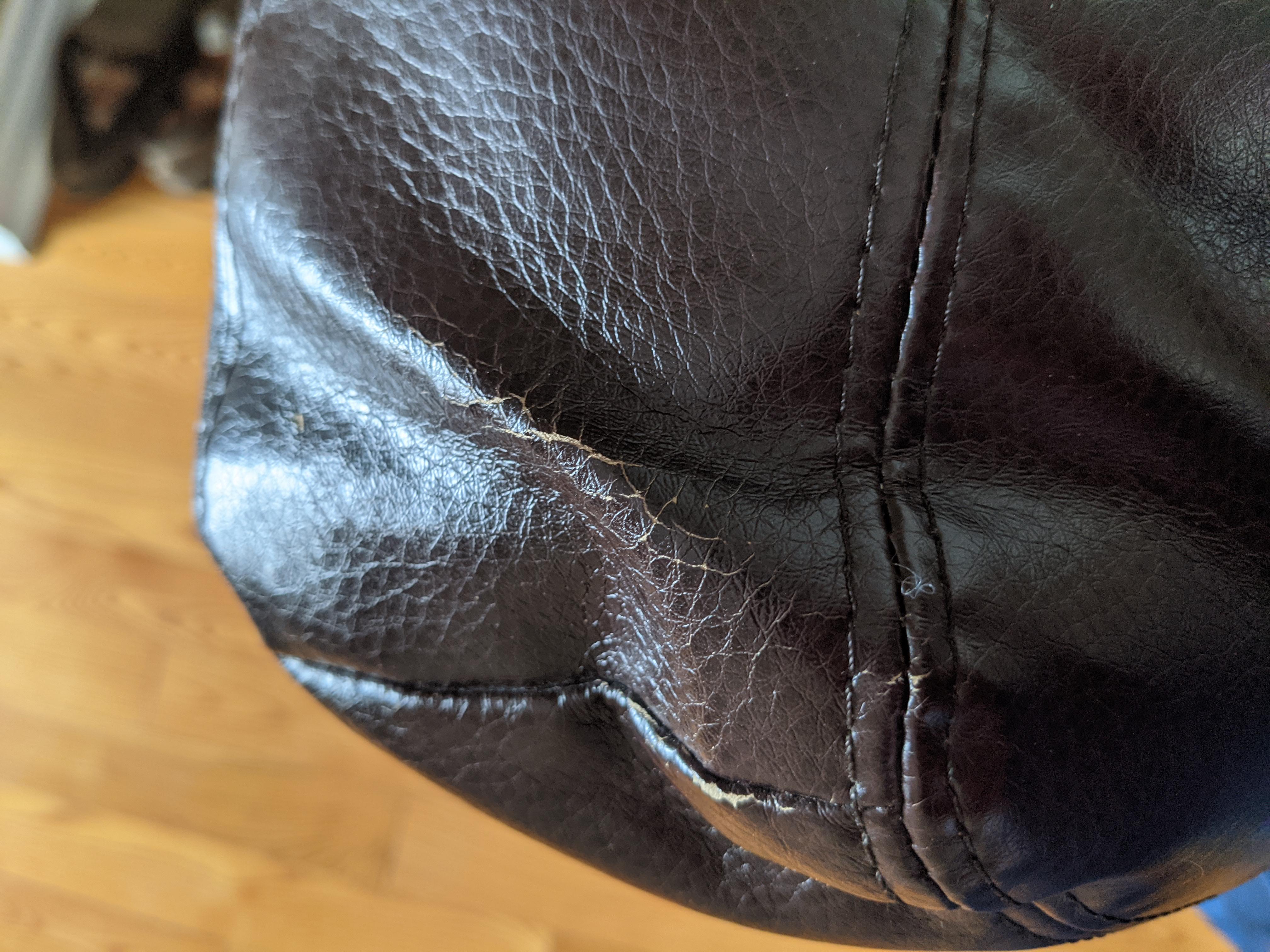 My faux leather couch is cracking. This side is facing the front door, exposing it to cold and