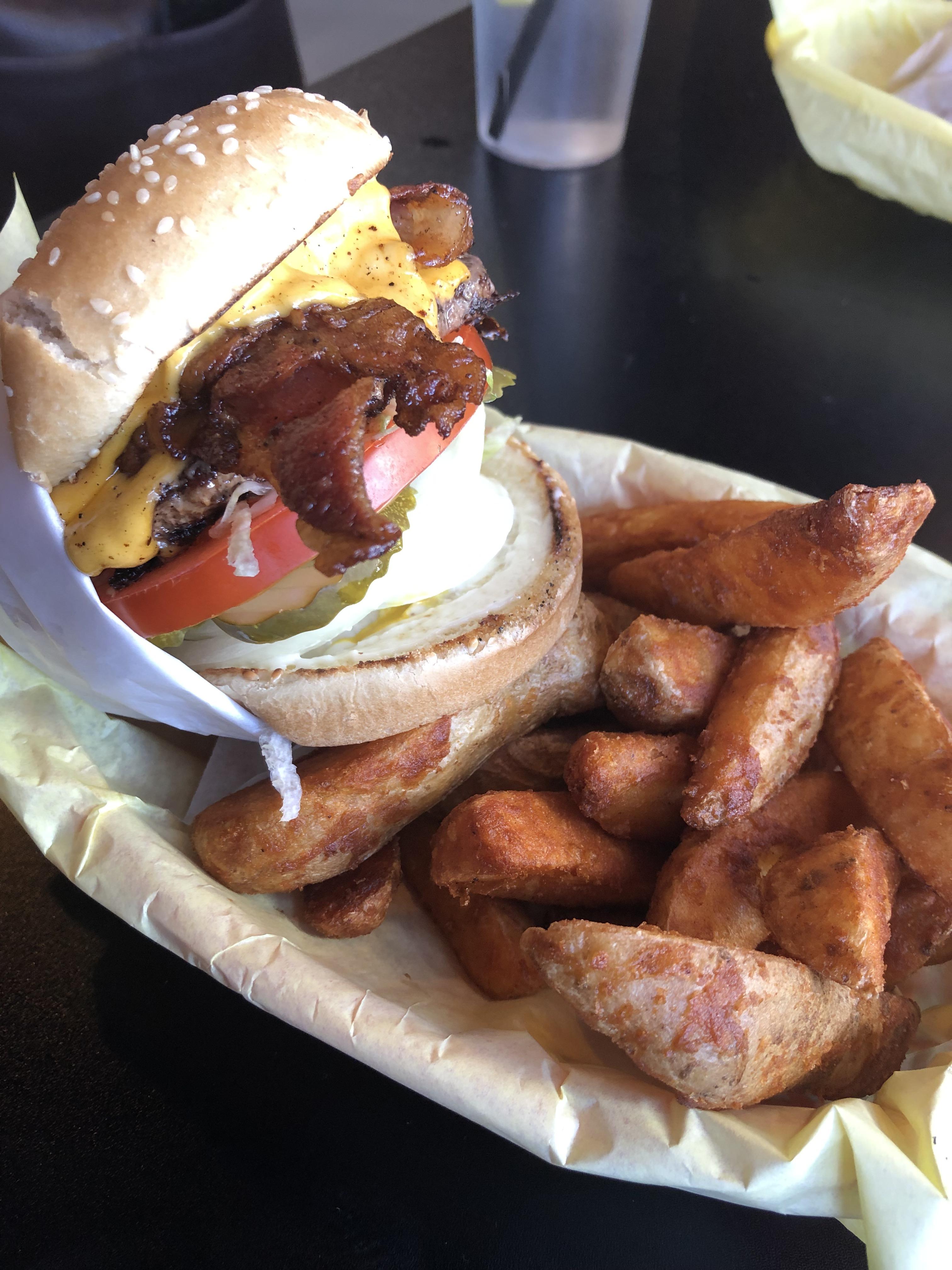 Single bacon cheeseburger with fries from Hodads in San Diego, CA r