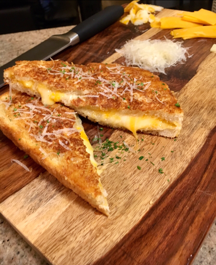 Swiss, Cheddar, Colby jack grilled cheese with a parmesan crust. r