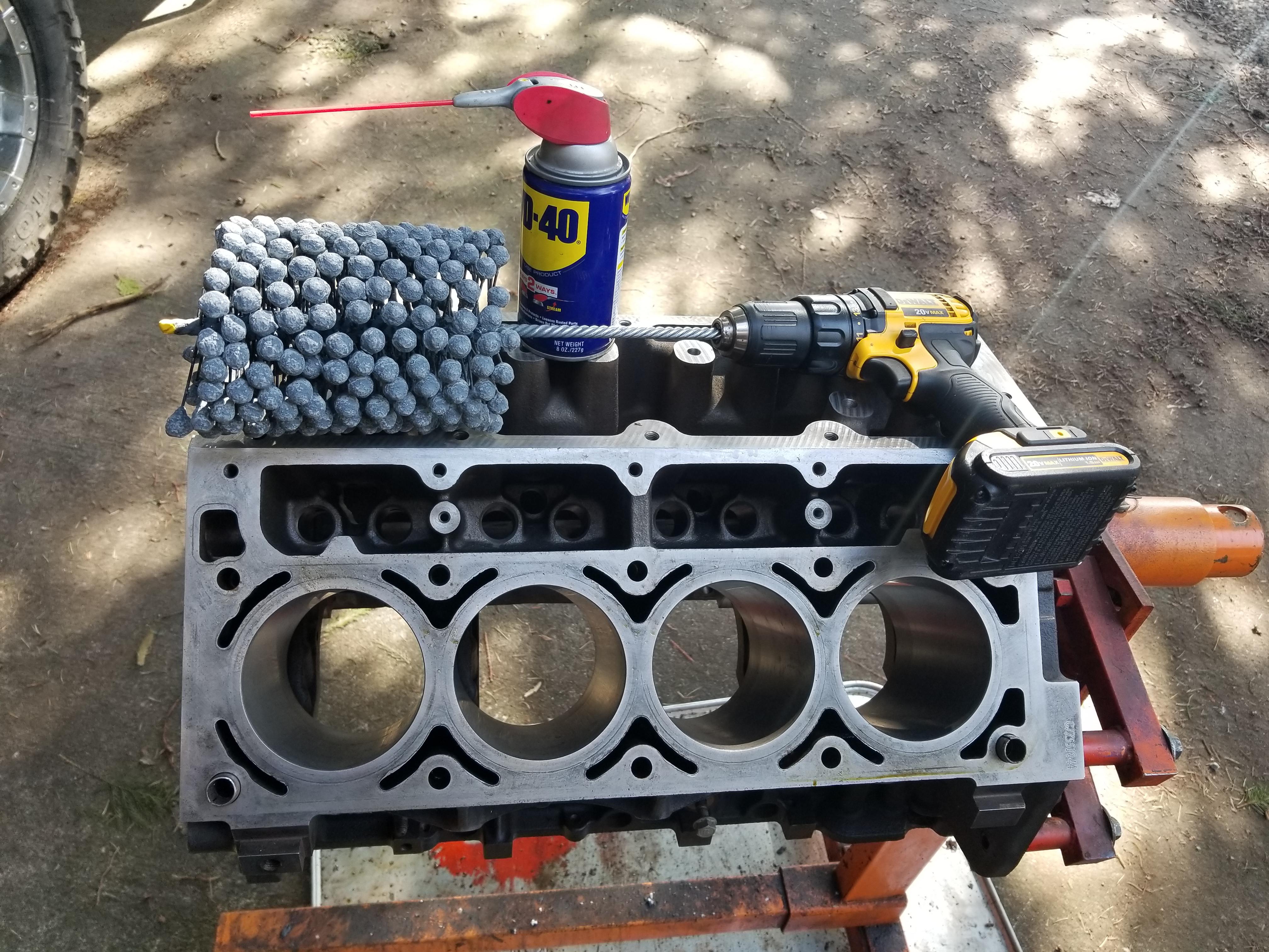 Spec'd out nominal so just hit it with a 400 grit hone for moly rings