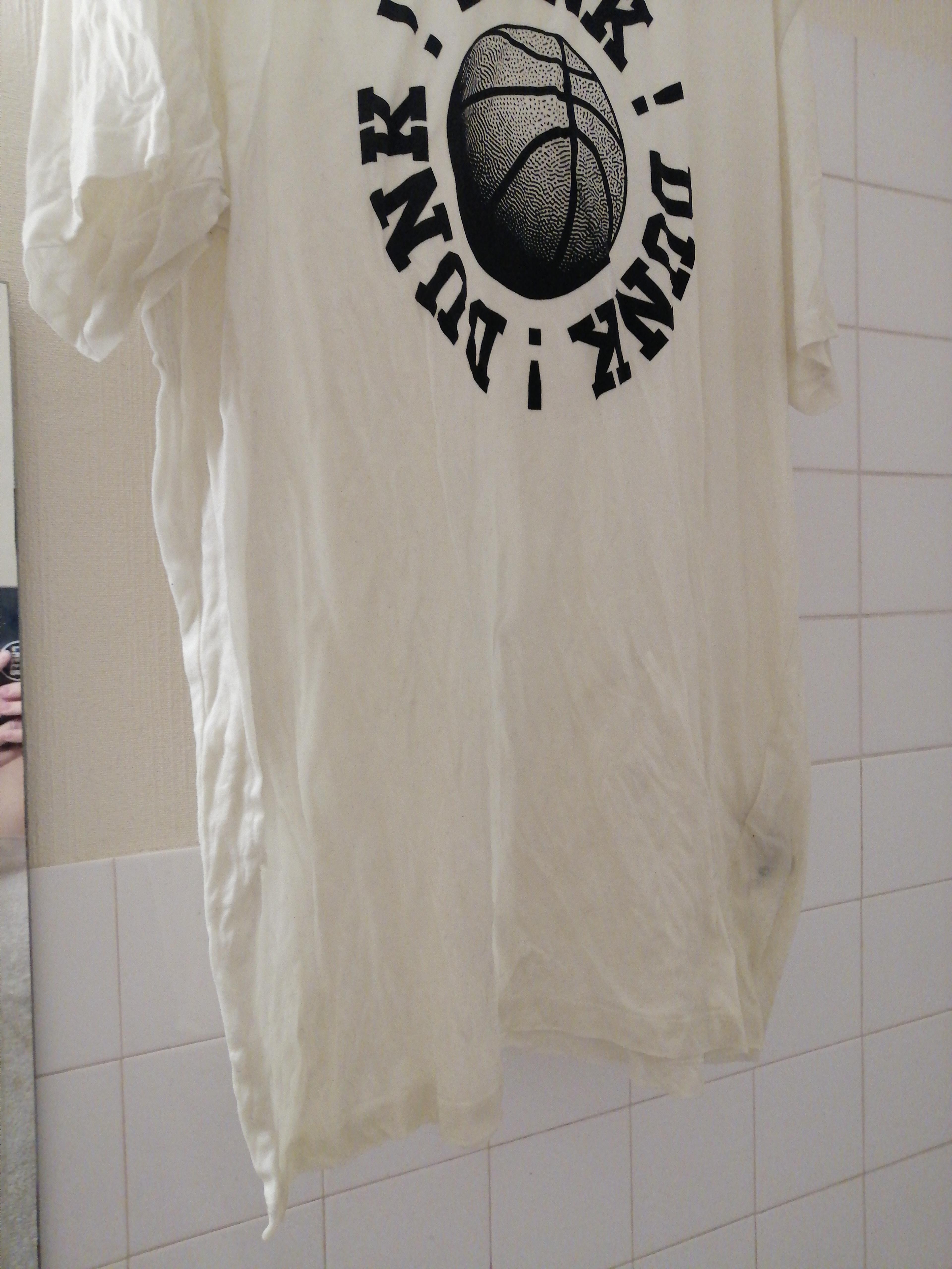 This white shirt became yellowish because of another piece of clothing