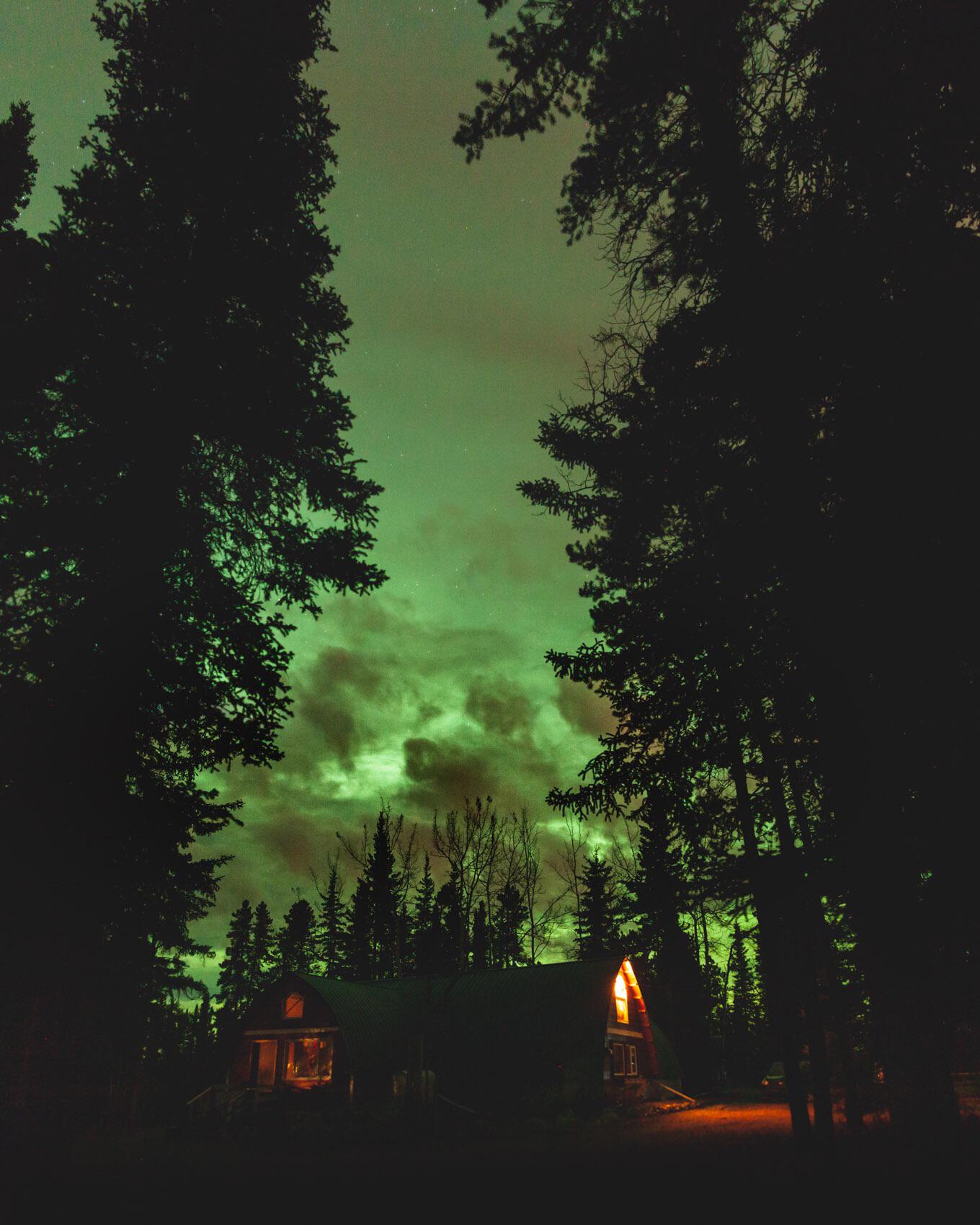 The northern lights on a cloudy night makes it look like a portal to