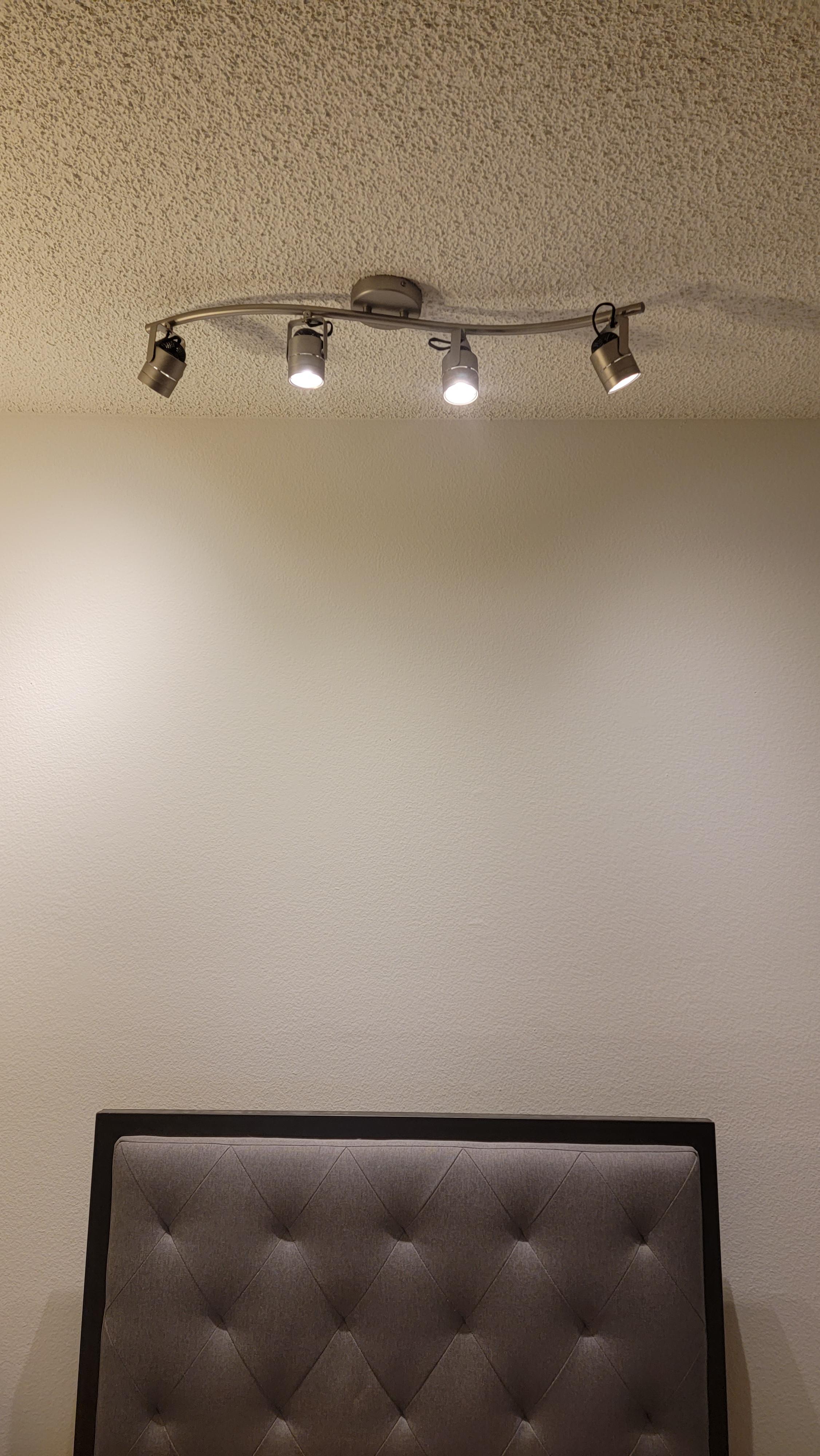 Is it safe to have track lighting over bed? (My apt came like this