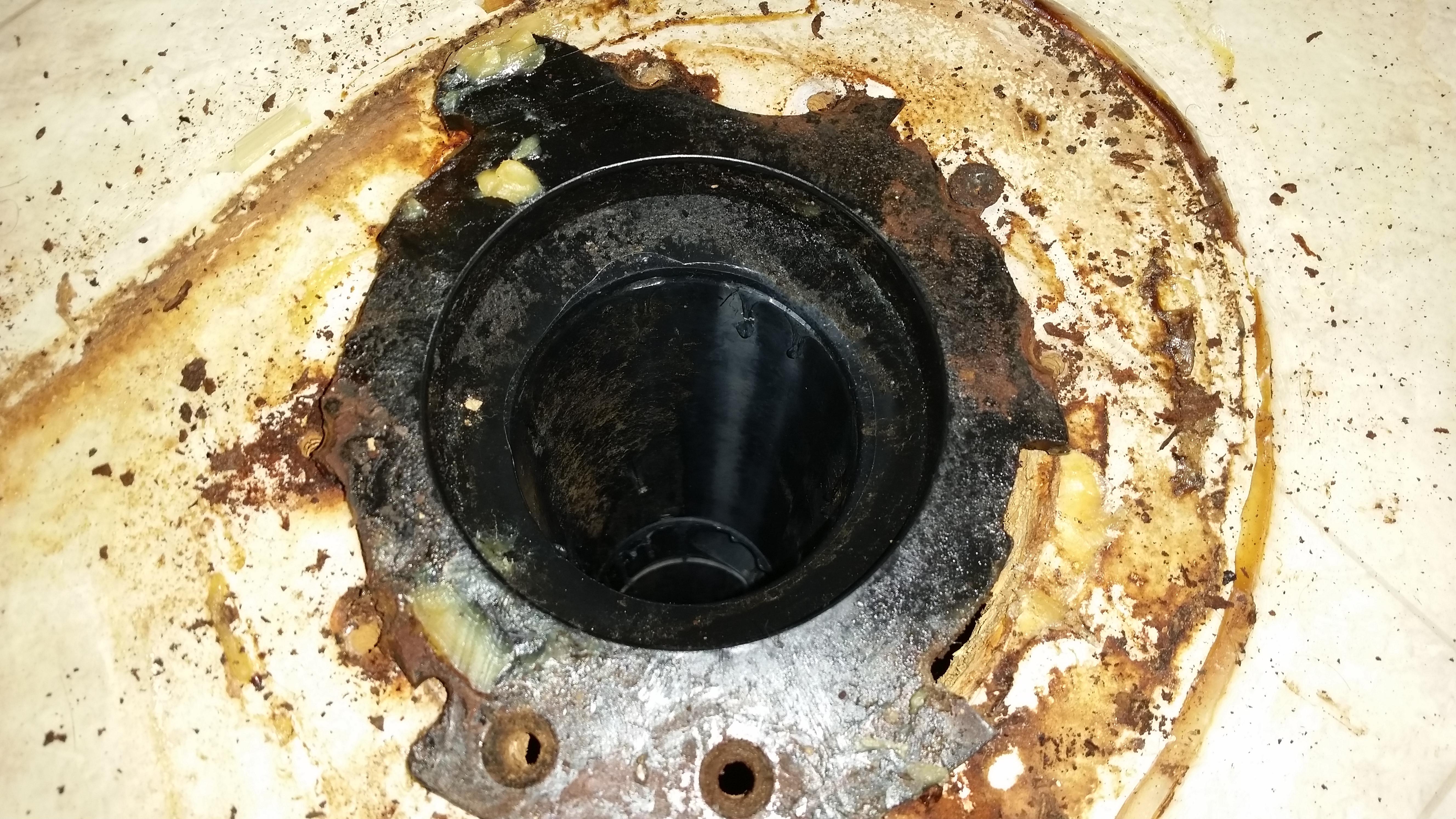 How to remove a toilet flange that's fused with the sewer pipe? [15