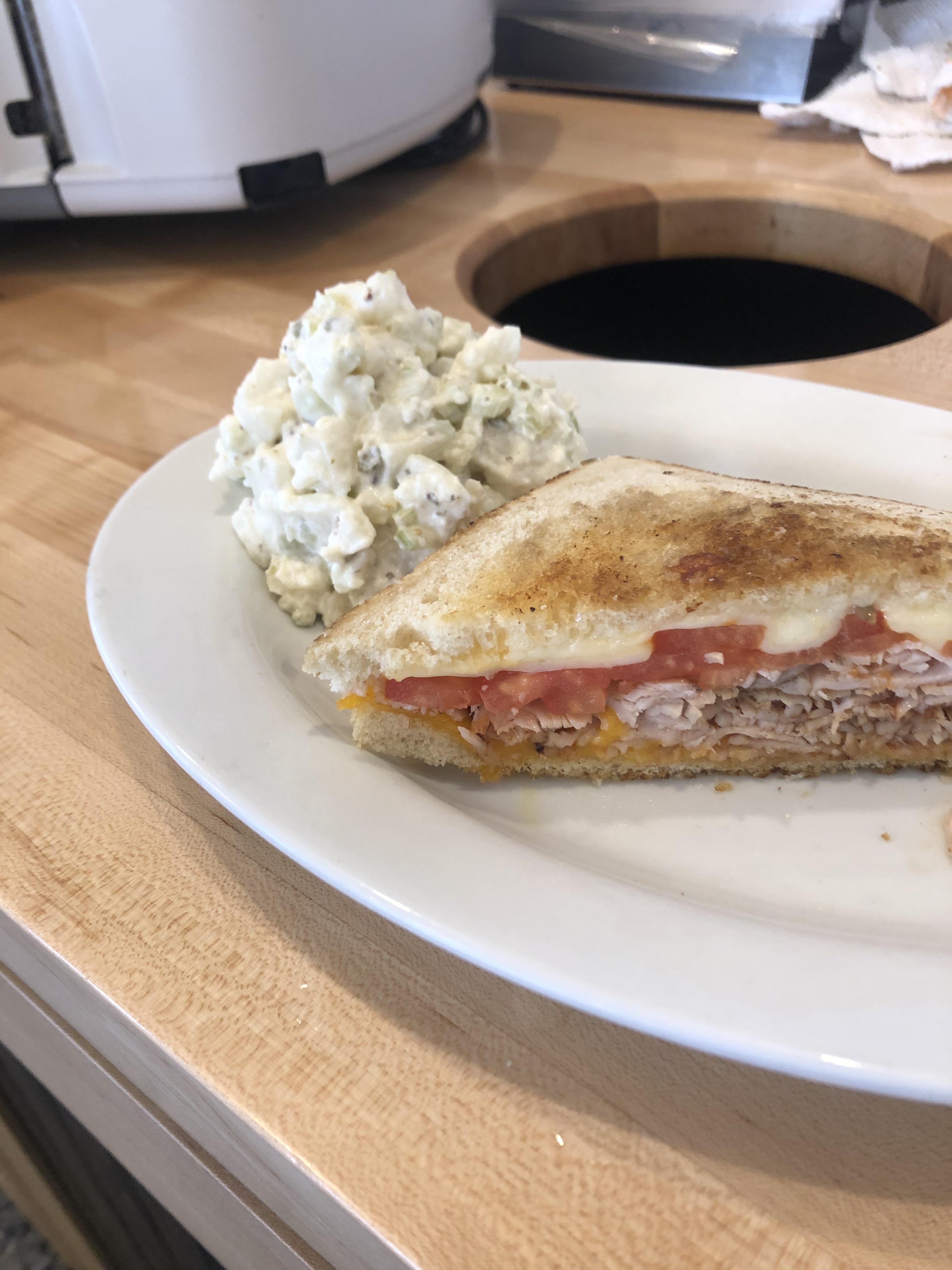 Turkey pastrami , tomato, Muenster and cheddar on sourdough. I work at