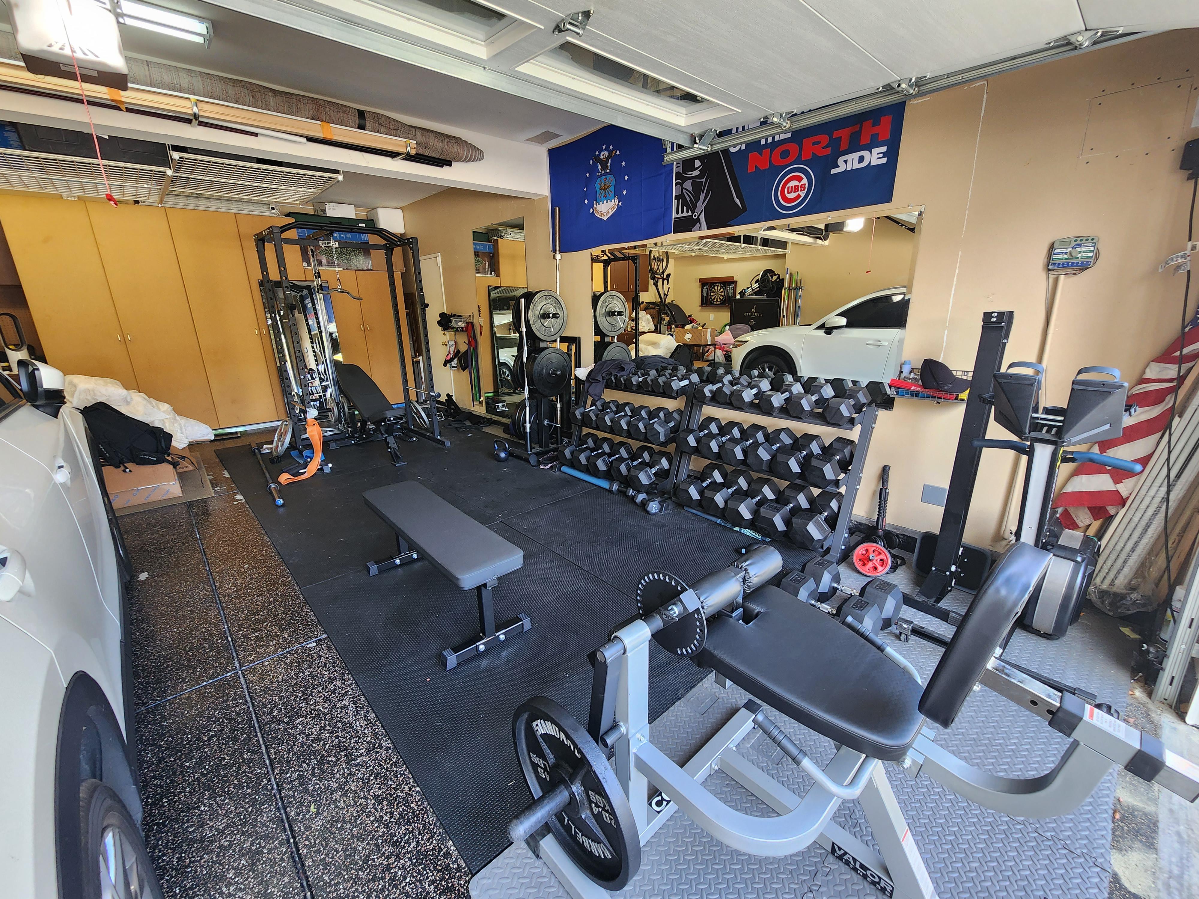 Here's my home gym setup, wife got me a new flat bench and leg curl