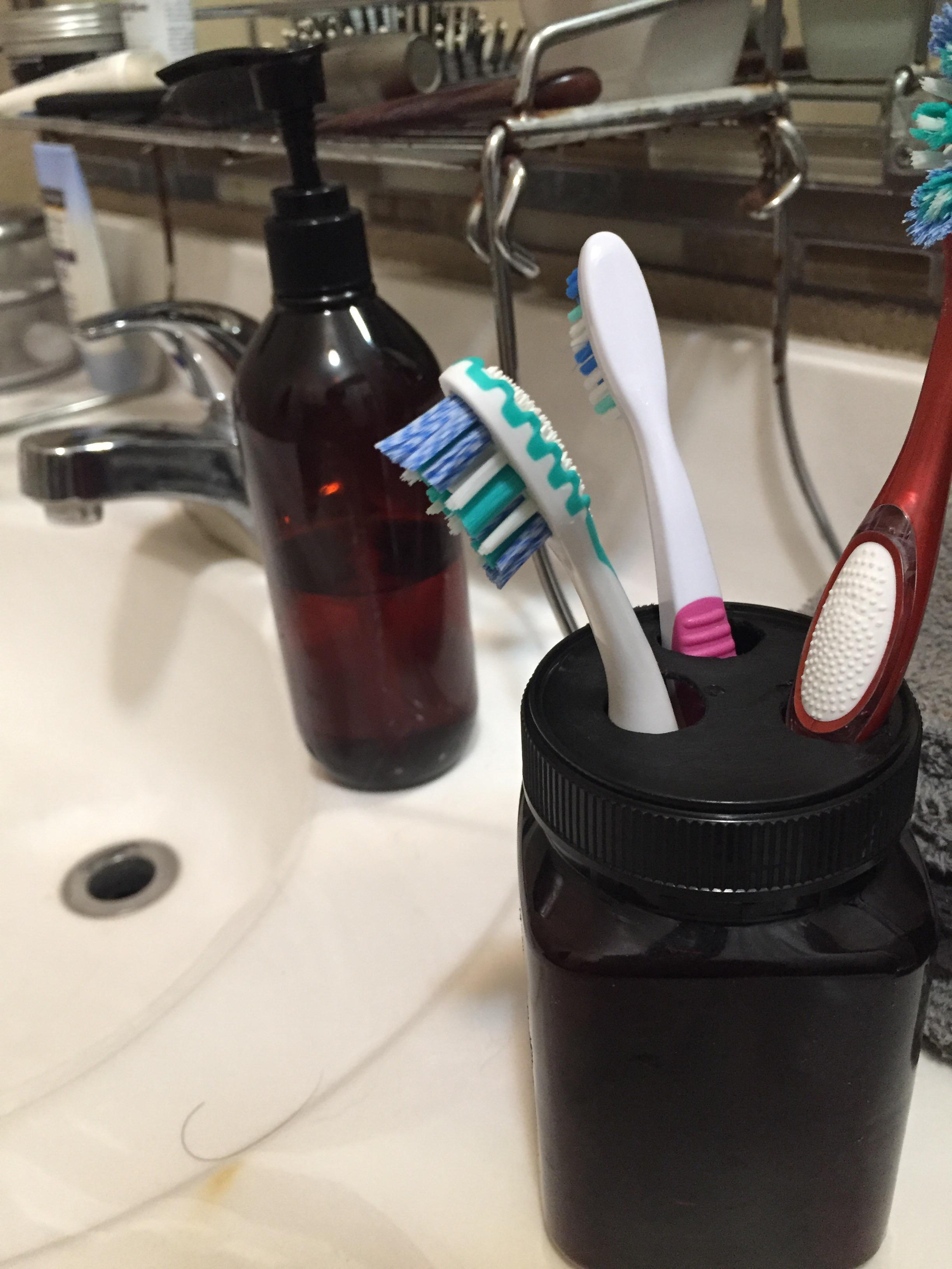 Turned this plastic honey jar into an amber “glass” toothbrush holder to match my empty