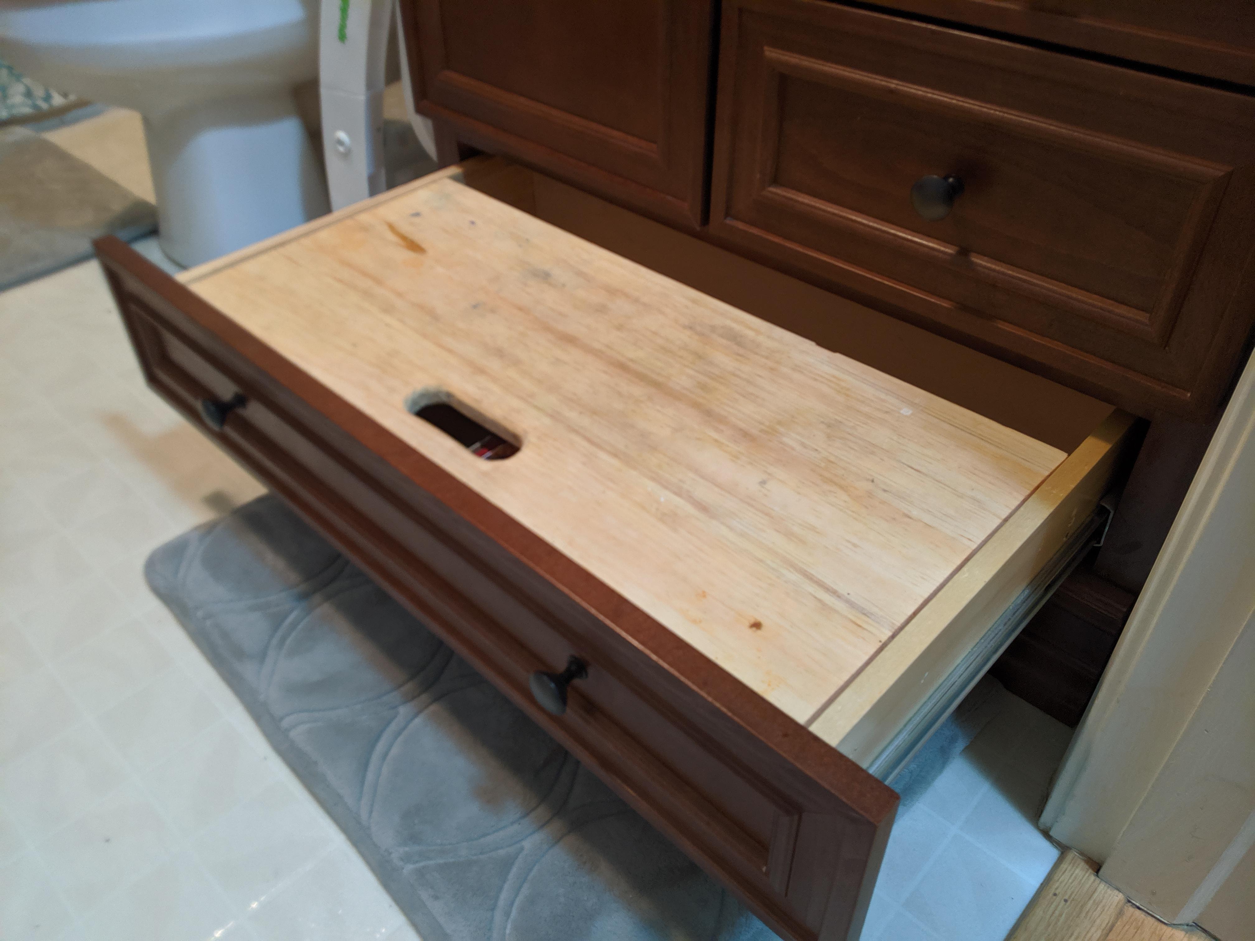 Need suggestions how to lock this drawer open. I turned the bottom