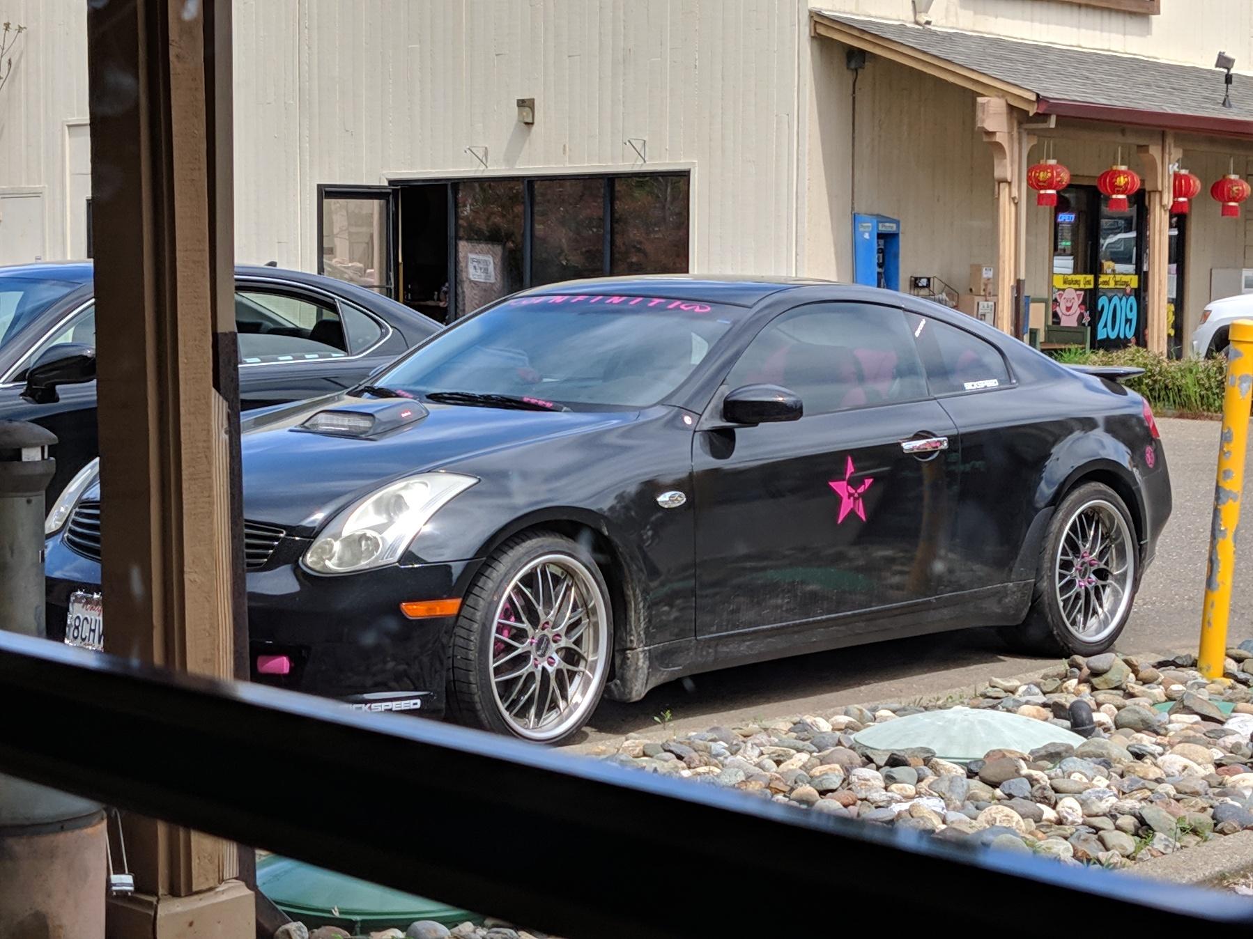 The pink lug nut covers are a nice touch r/ShittyCarMod