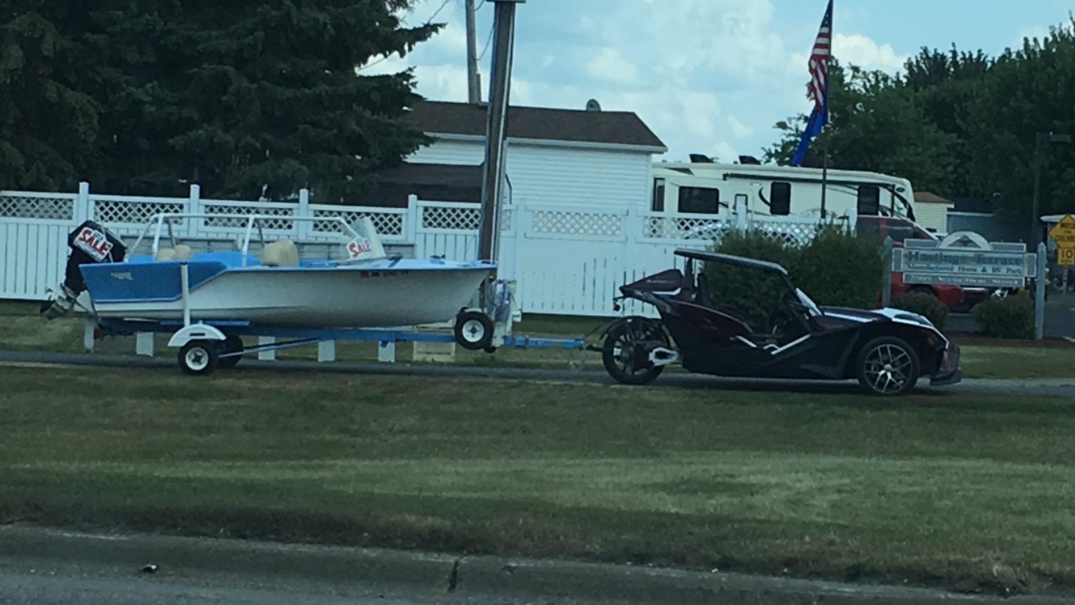 This Polaris Slingshot has a hitch and is towing a boat. : r