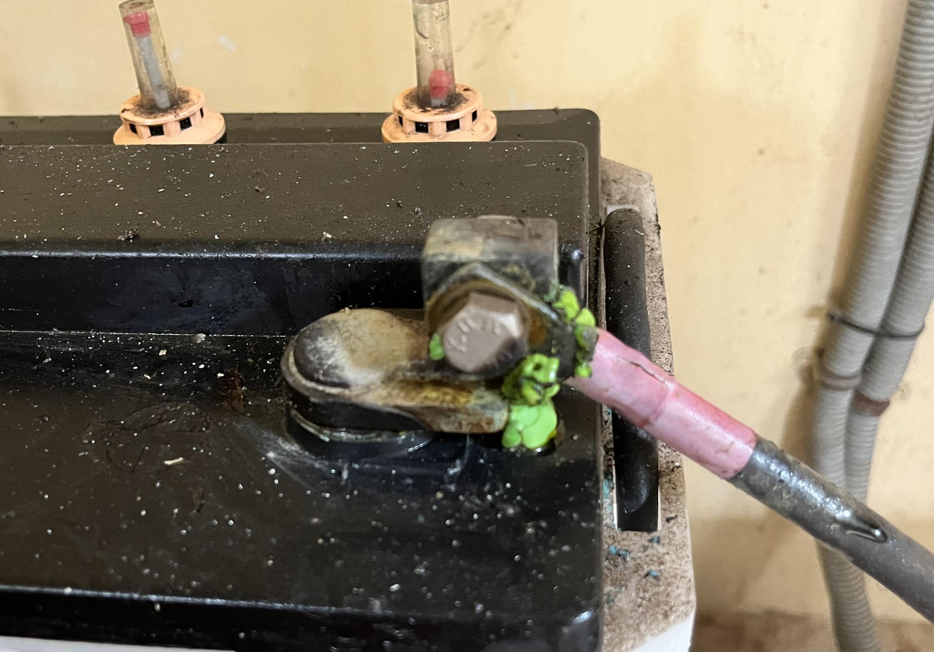What is this green coating on lead acid battery terminal? How to remove