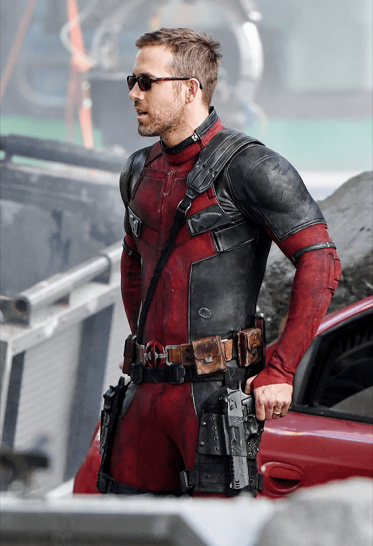 Ryan Reynolds in his Deadpool costume and a pair of sunglasses casually