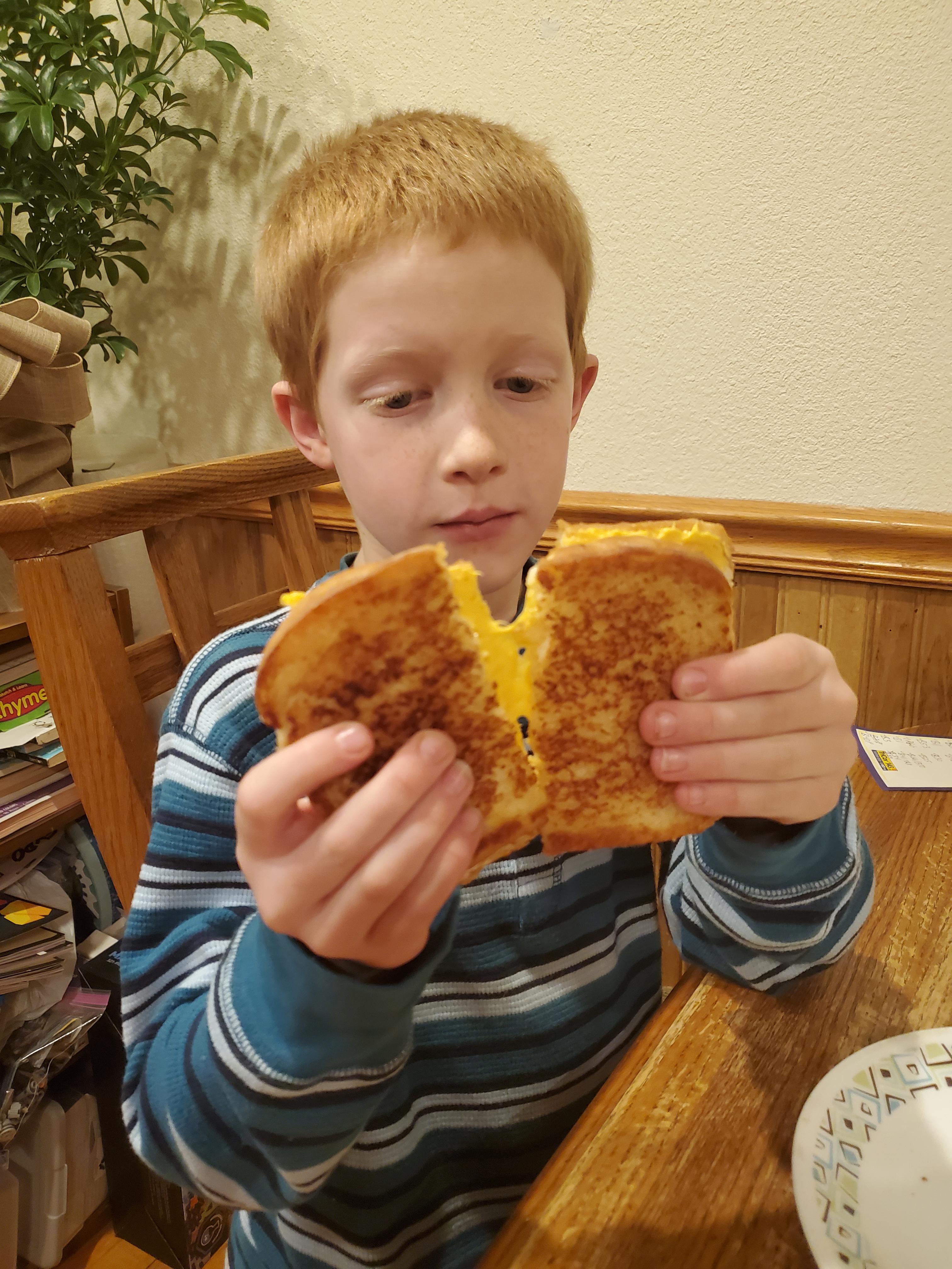 My 7yo showing off the first grilled cheese he cooked himself