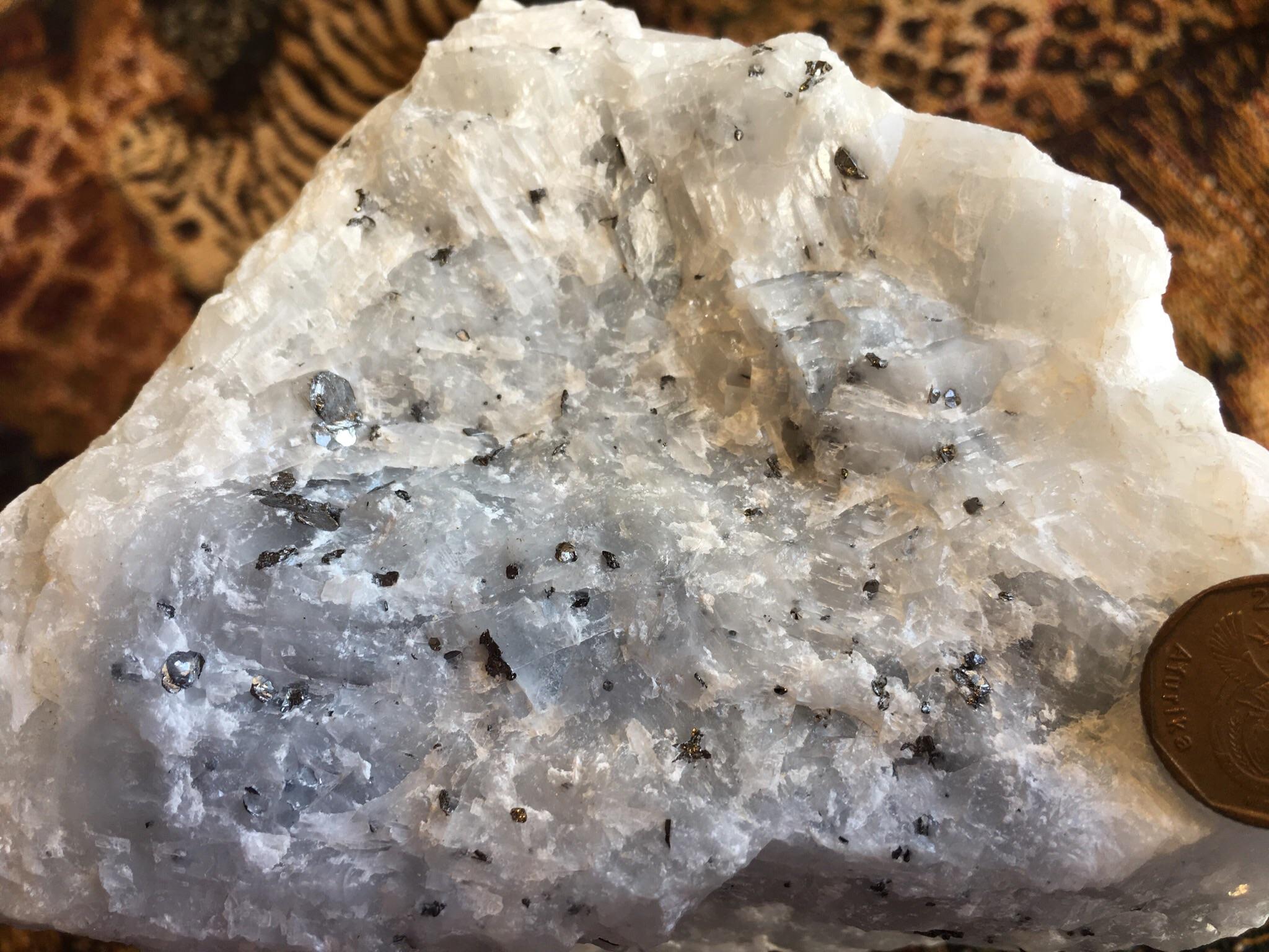Graphite crystals in limestone (KwazuluNatal, South Africa). r/geology