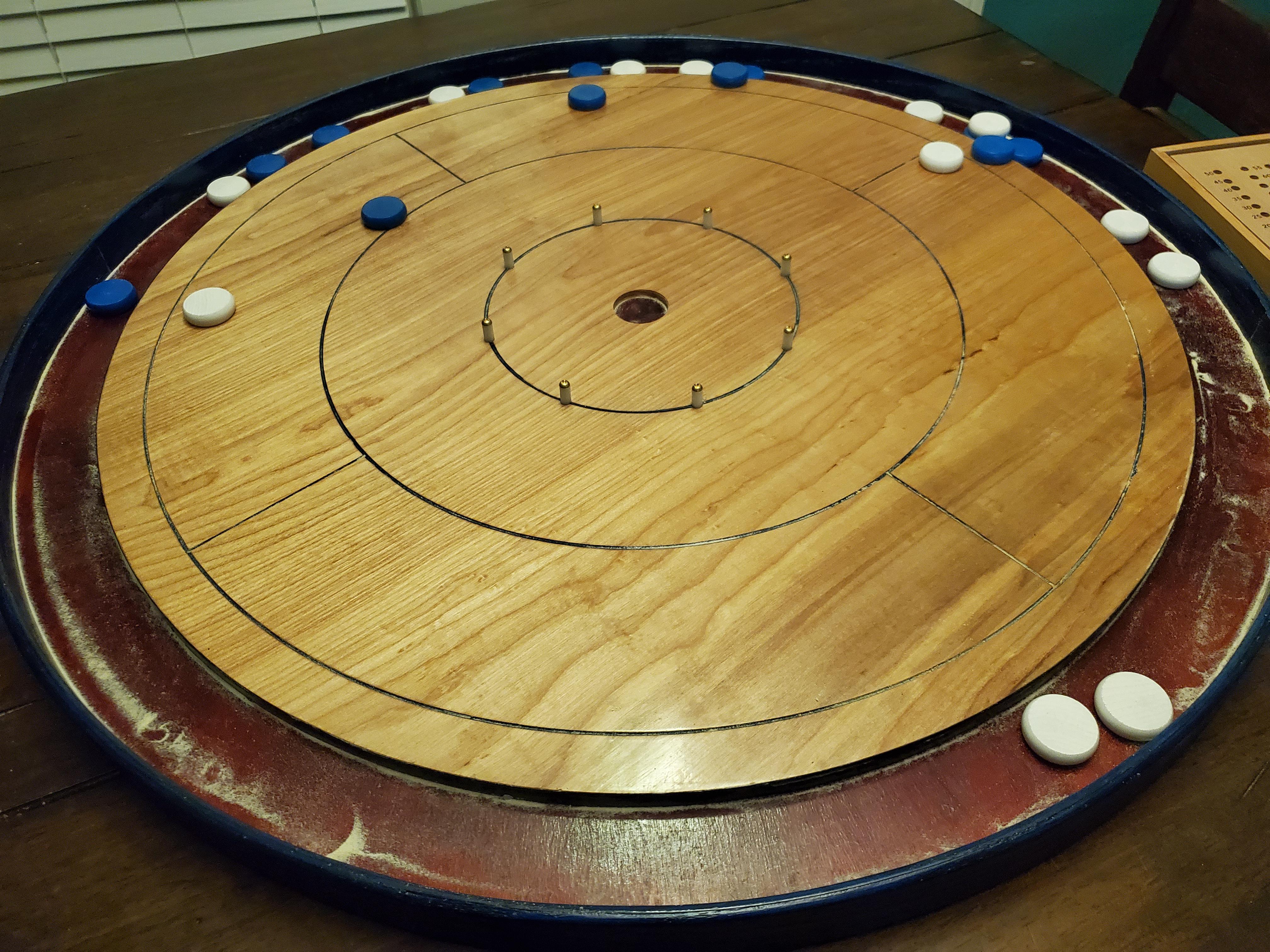 I inherited this old crokinole board from my Dad. I’m wondering what’s