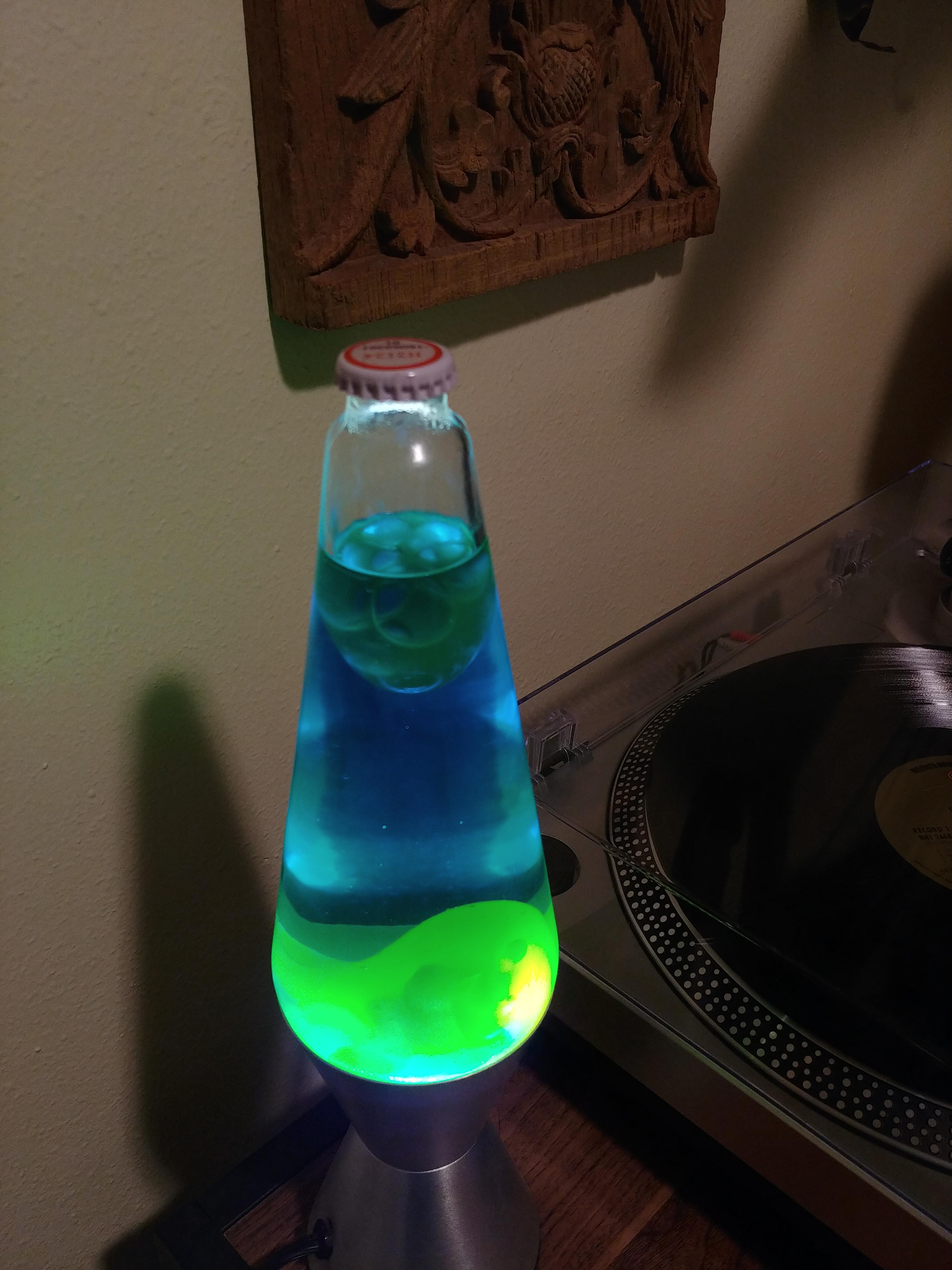 My lava lamp has a bottle cap under its cover r/mildlyinteresting