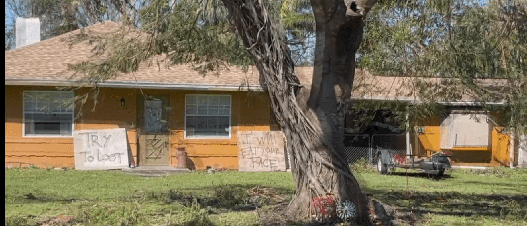 Signs in front of house in Tice, FL after Hurricane Ian r/pics