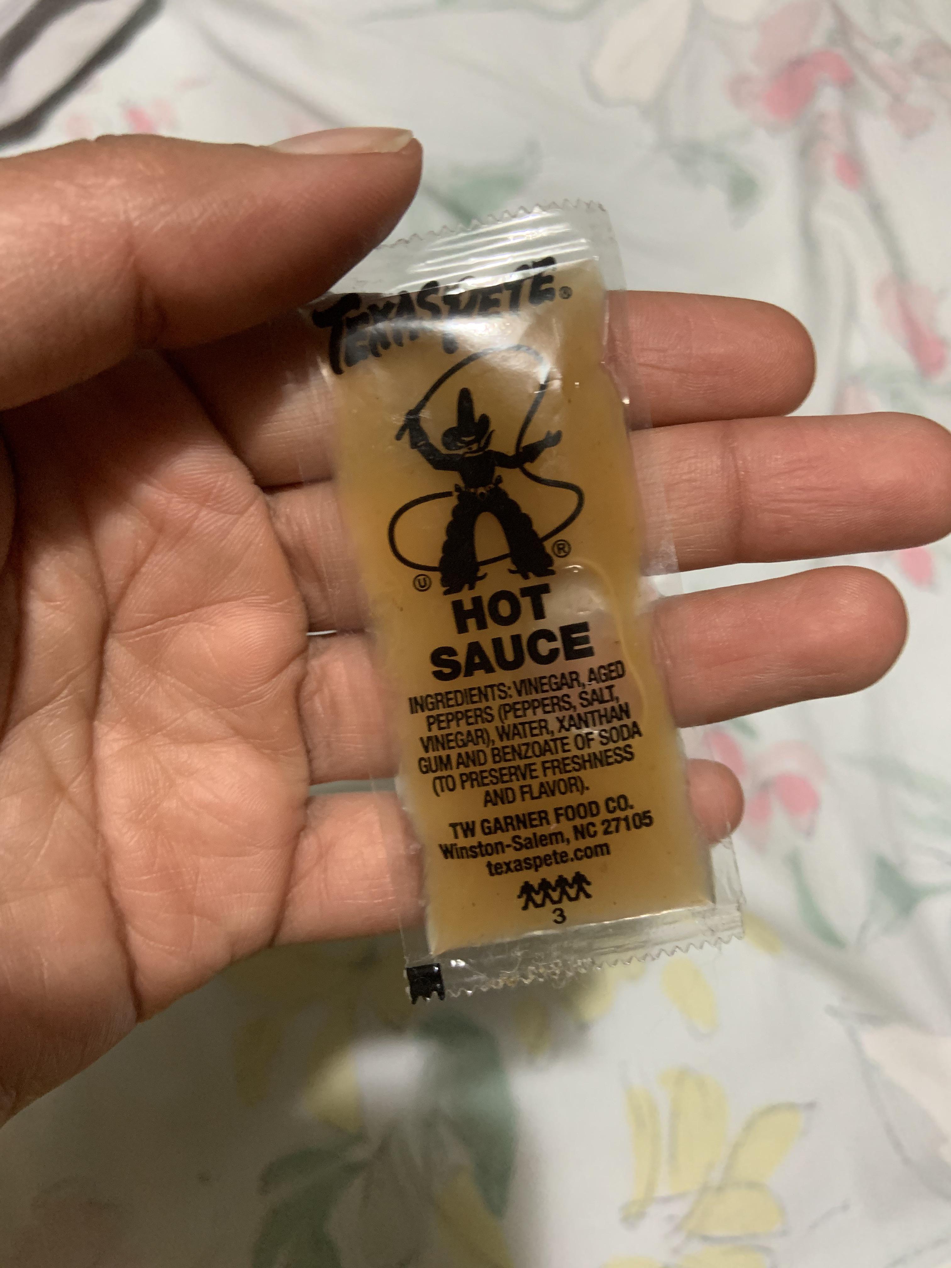This packet of Texas Pete hot sauce turned yellow after sitting for a while r/mildlyinteresting