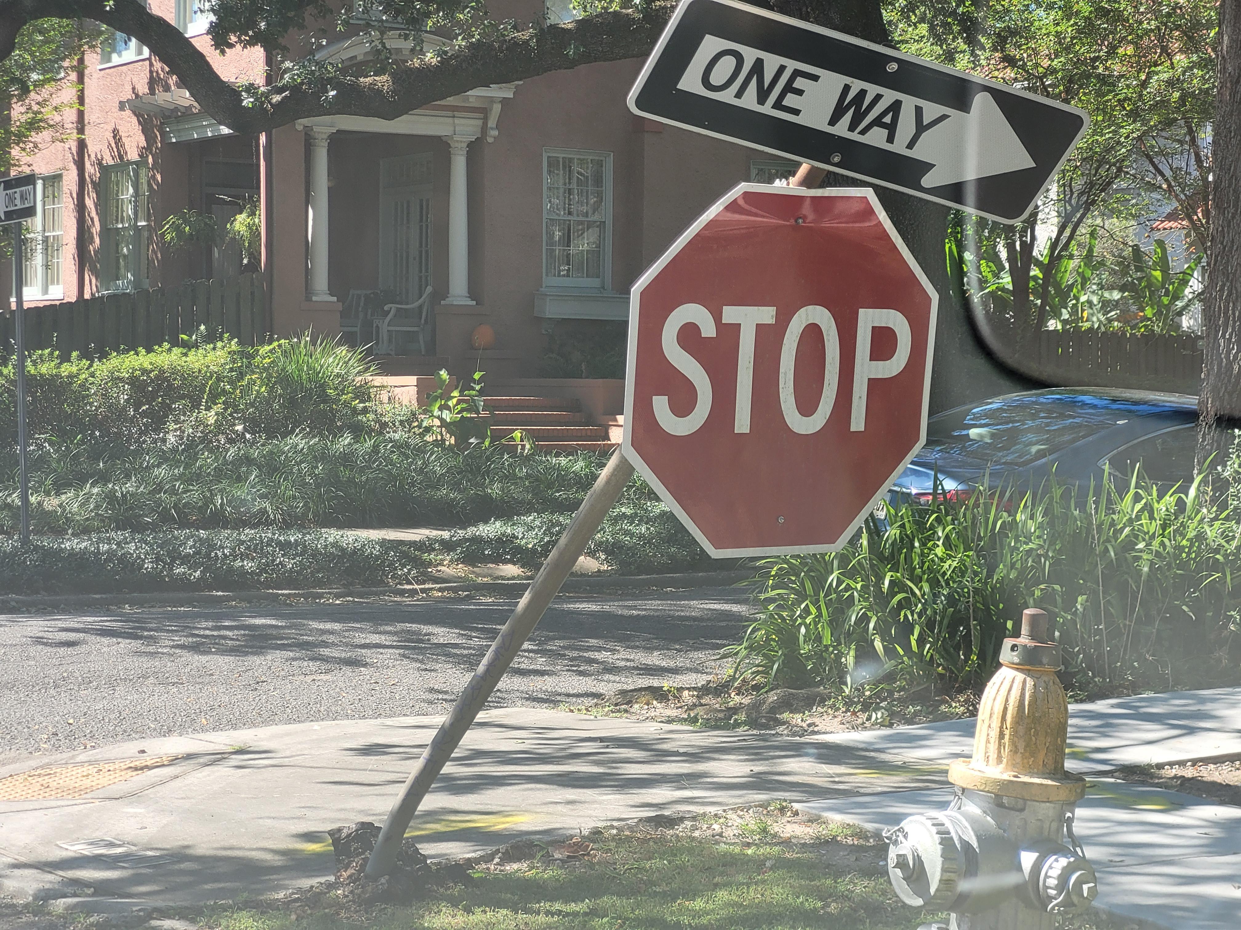 Stop sign on my street got bent over, making it difficult to see the