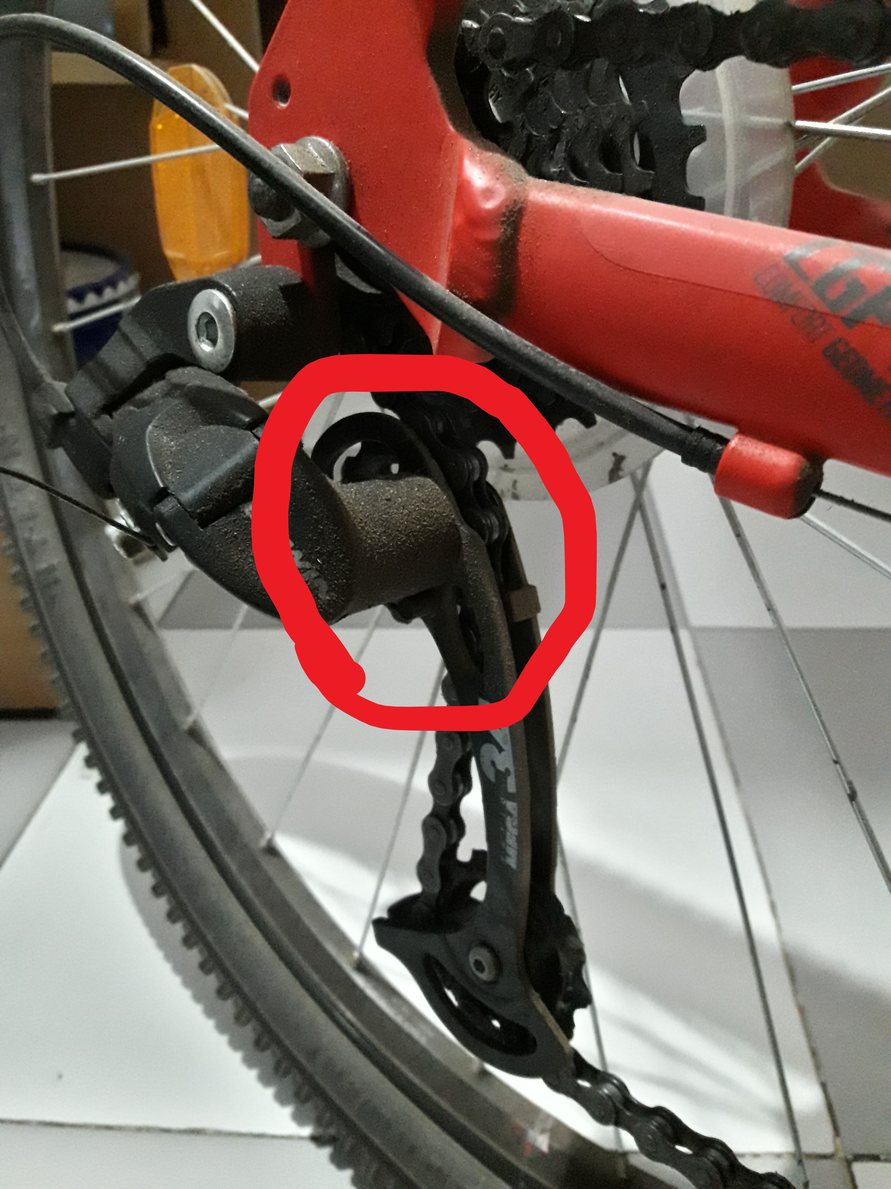 The "top" part of the rear derailleur is making noises while pedalling