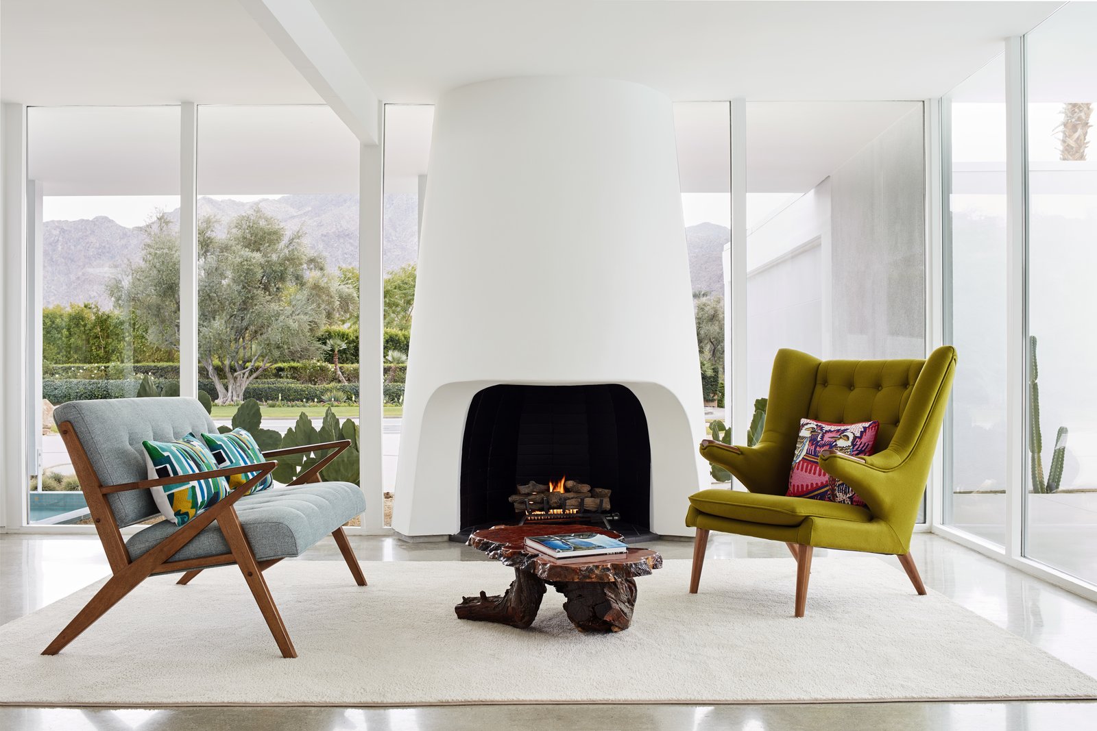 A freestanding, kivastyle fireplace in an International Style home