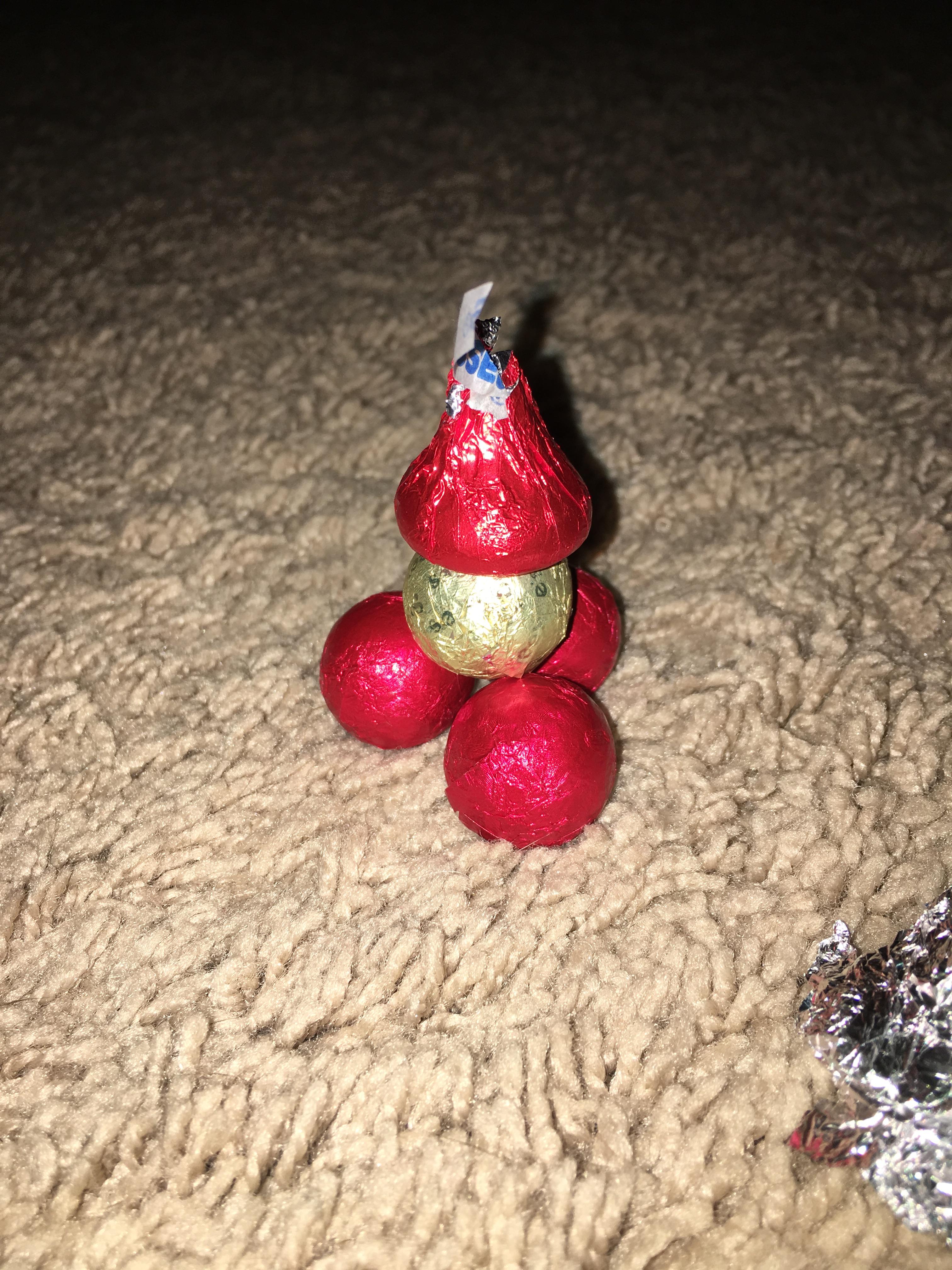 I somehow stacked my chocolate balls and put a Hershey kiss on top r
