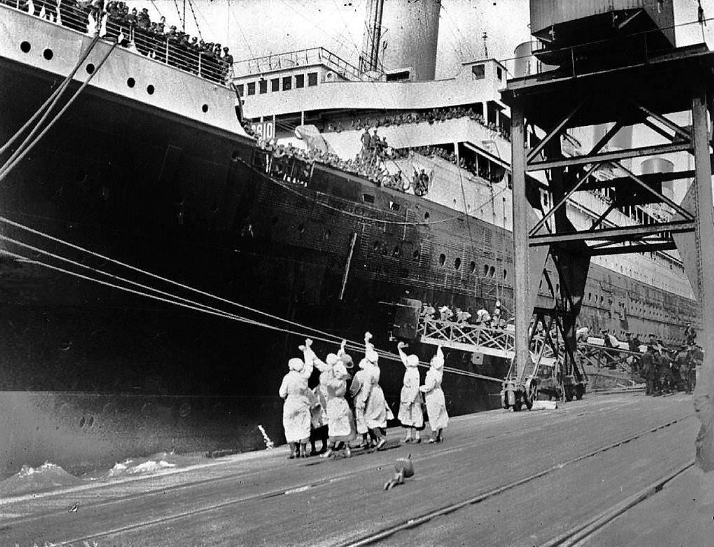 British nurses waving goodbye to Canadian soldiers onboard the HMT