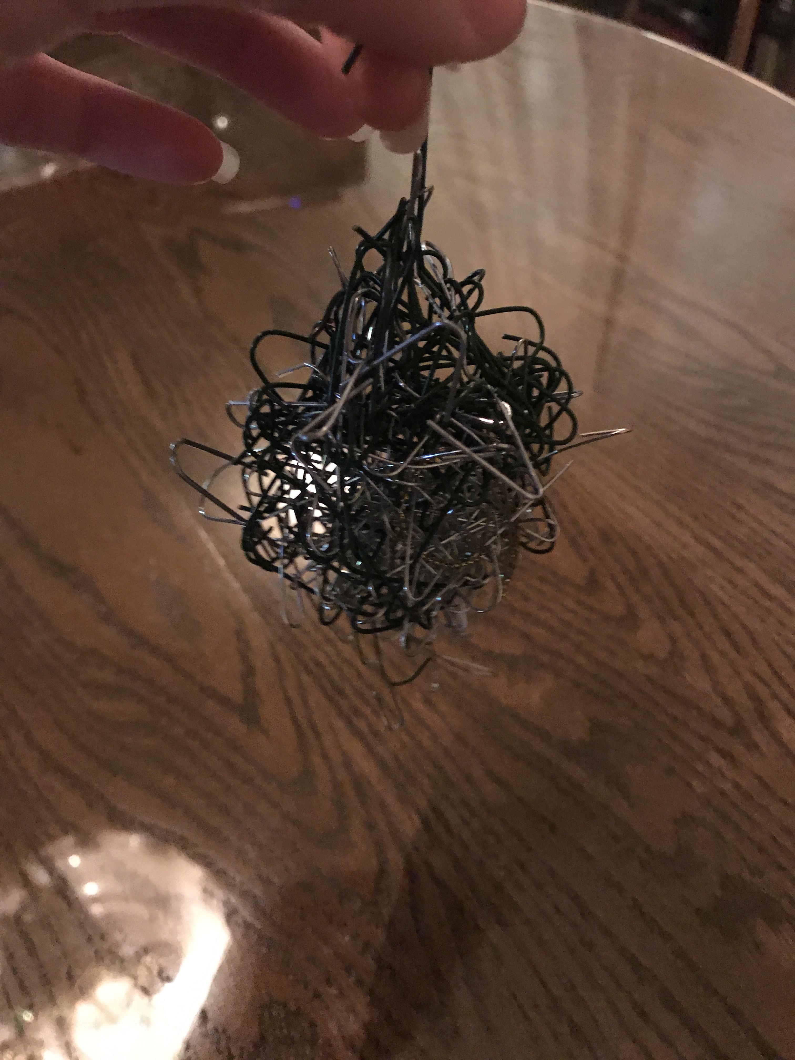 Mom asked that I help her untangle the ornament hooks & handed me this