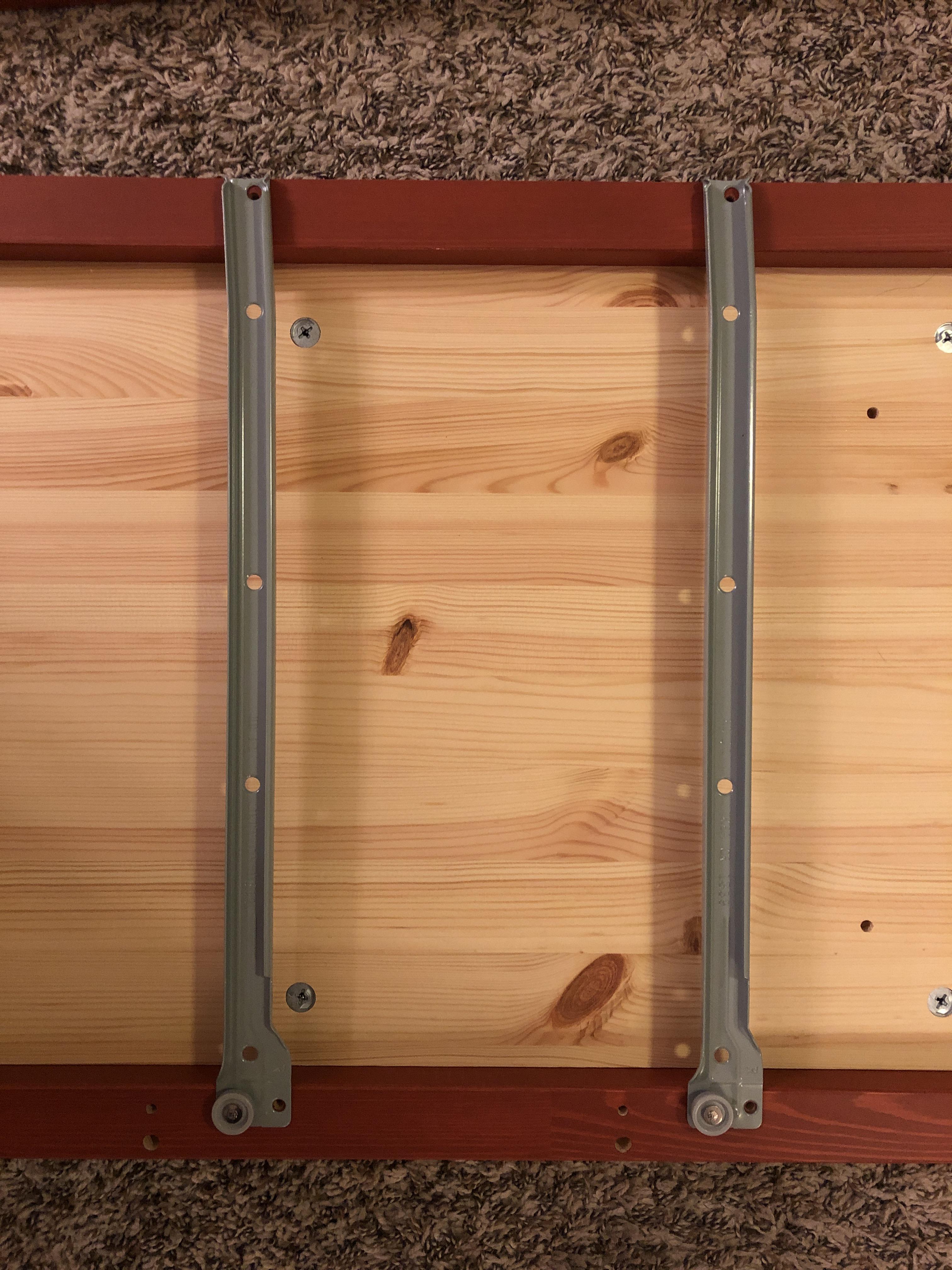 Hemnes Dresser sliding track does not align to holes in frame, help