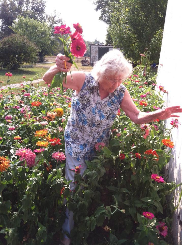 My grandma picking fresh flowers from her garden r/pics