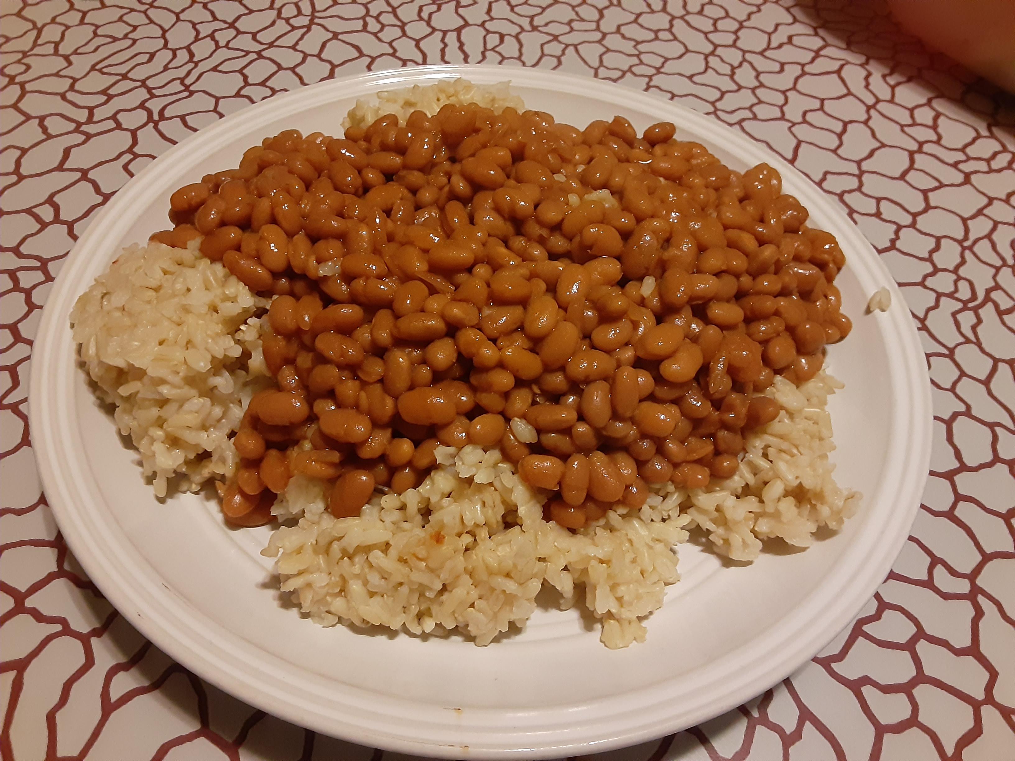 Brown rice served with baked beans and a side of depression r