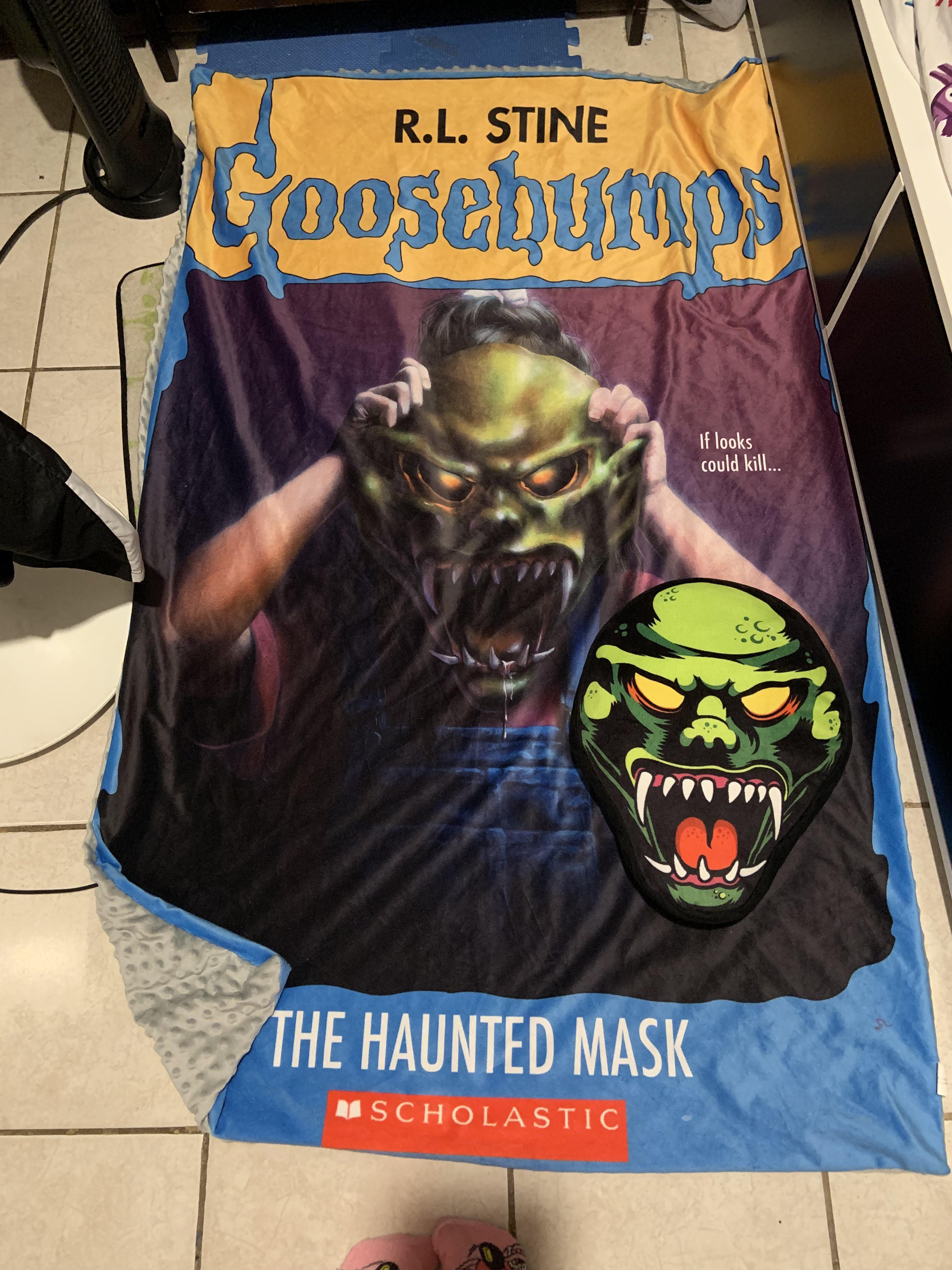 The haunted mask blanket and matching pillow from Creepy Co. I flipped