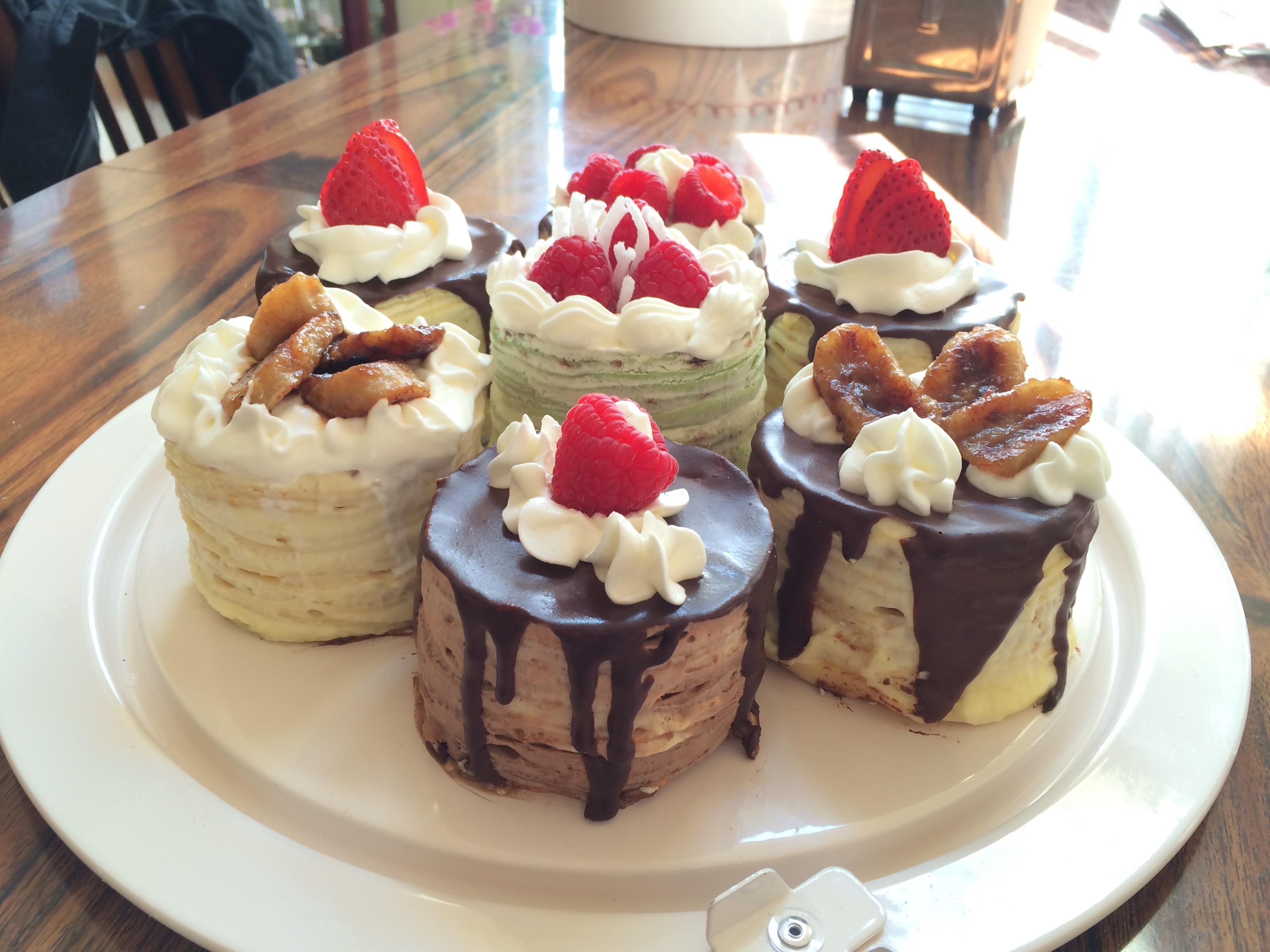 Made mini crepe cakes! (bananas foster, chocolate, pandan, and vanilla