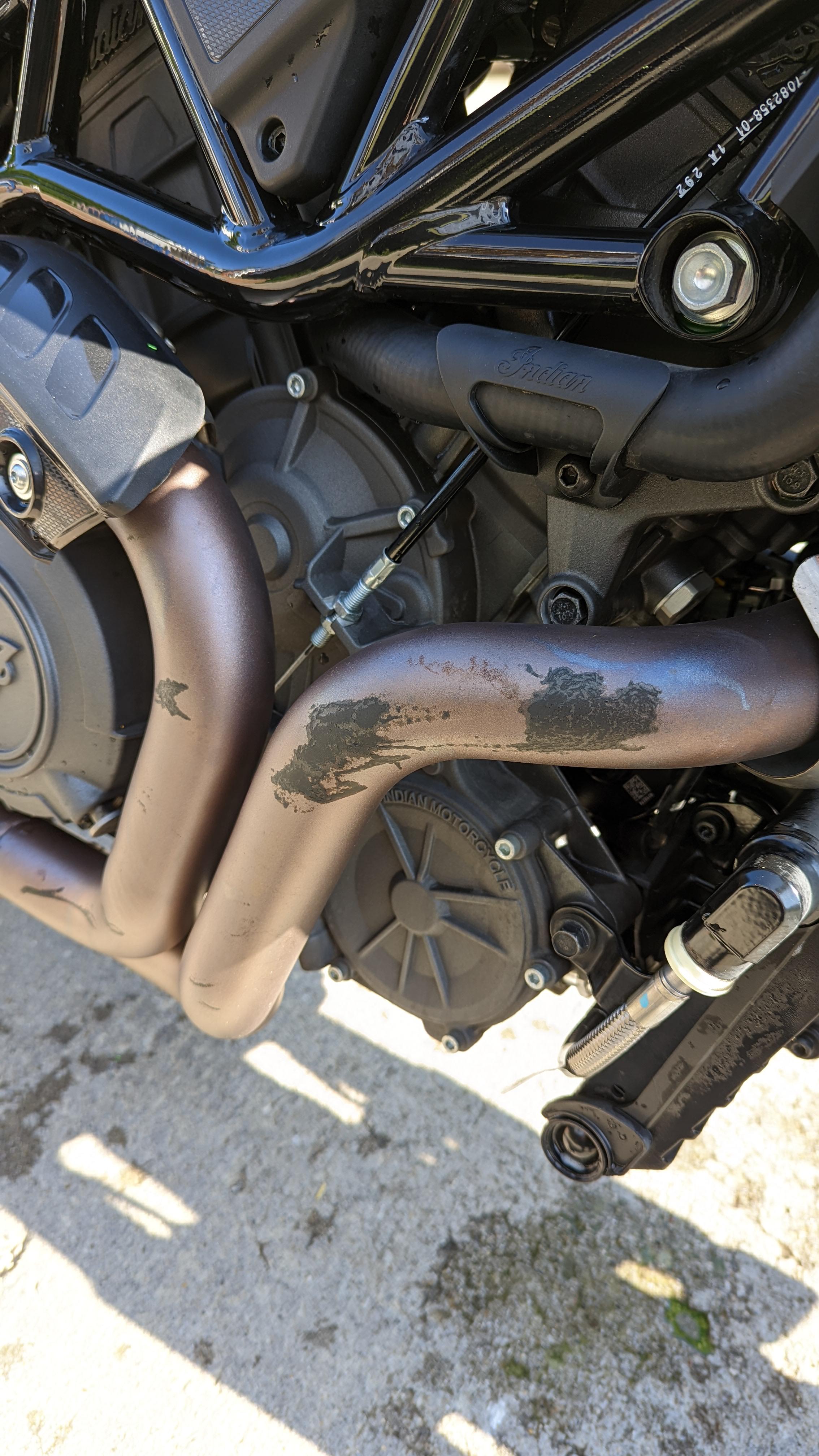 Part of my Motorcycle Tarp Melted onto my Exhaust, on