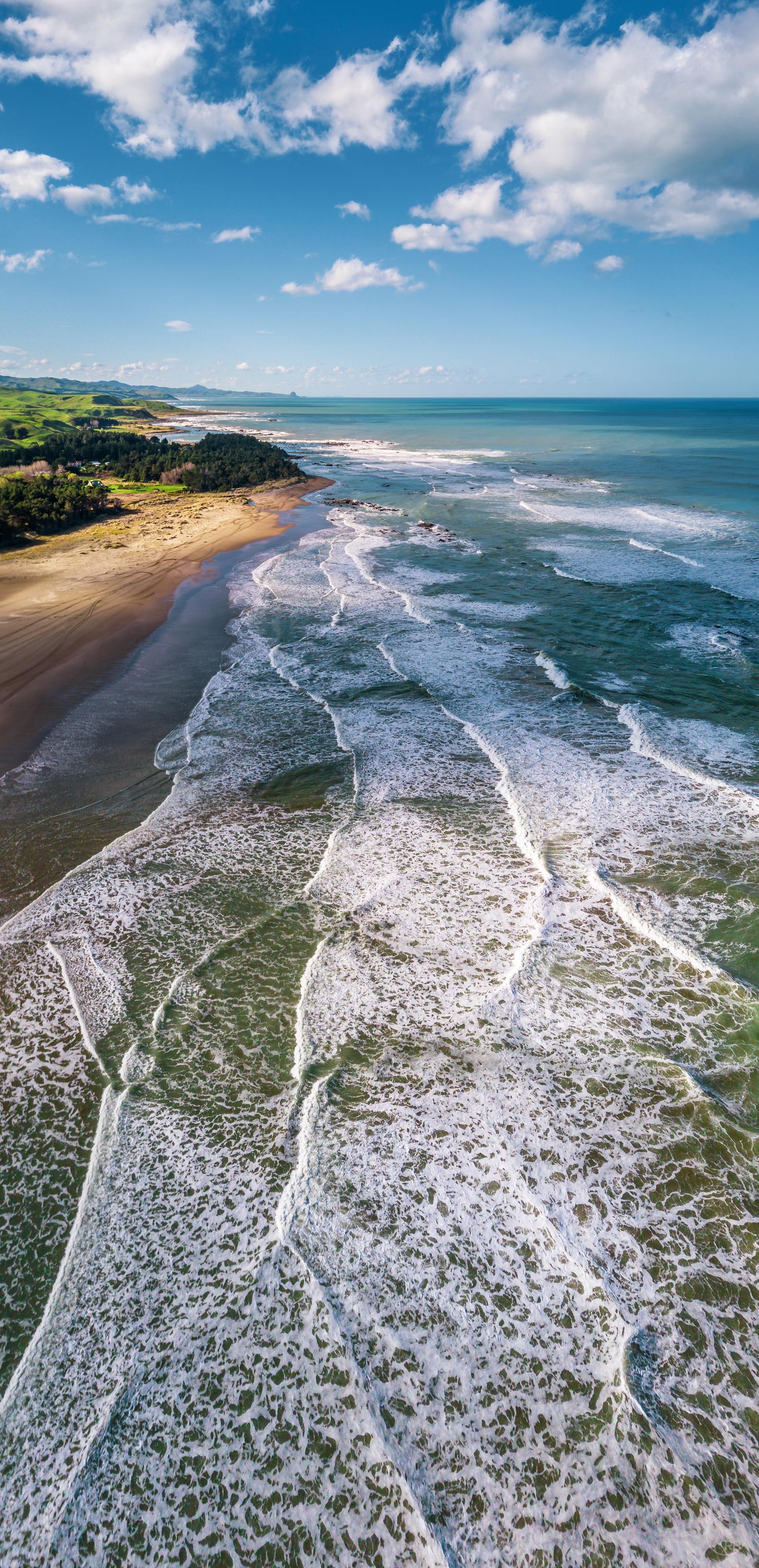 A vertical pano looking up the coastline from Riversdale Beach, New