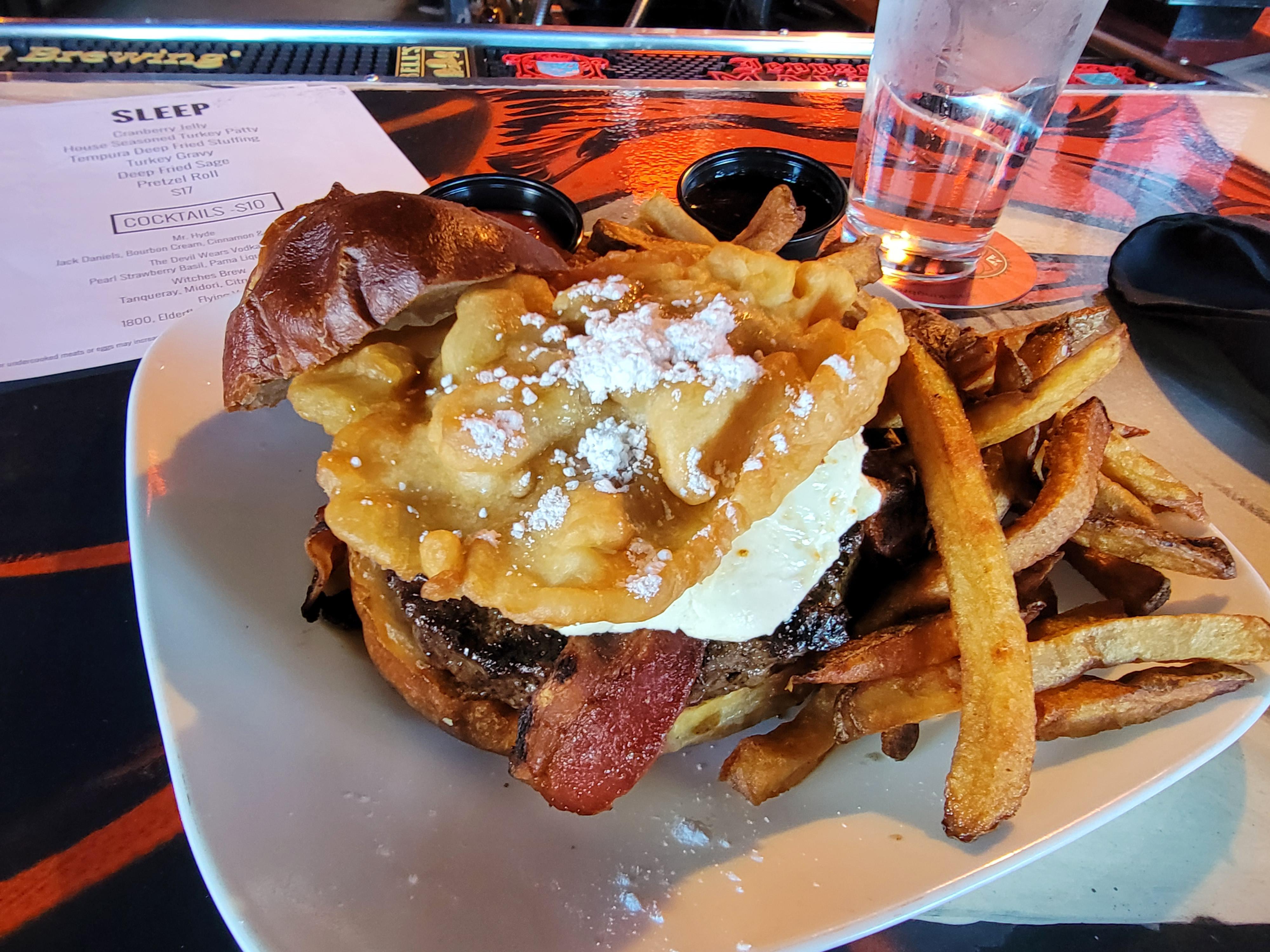 [I ate] Burger with cayenne candied bacon, cherry preserves, goat cream