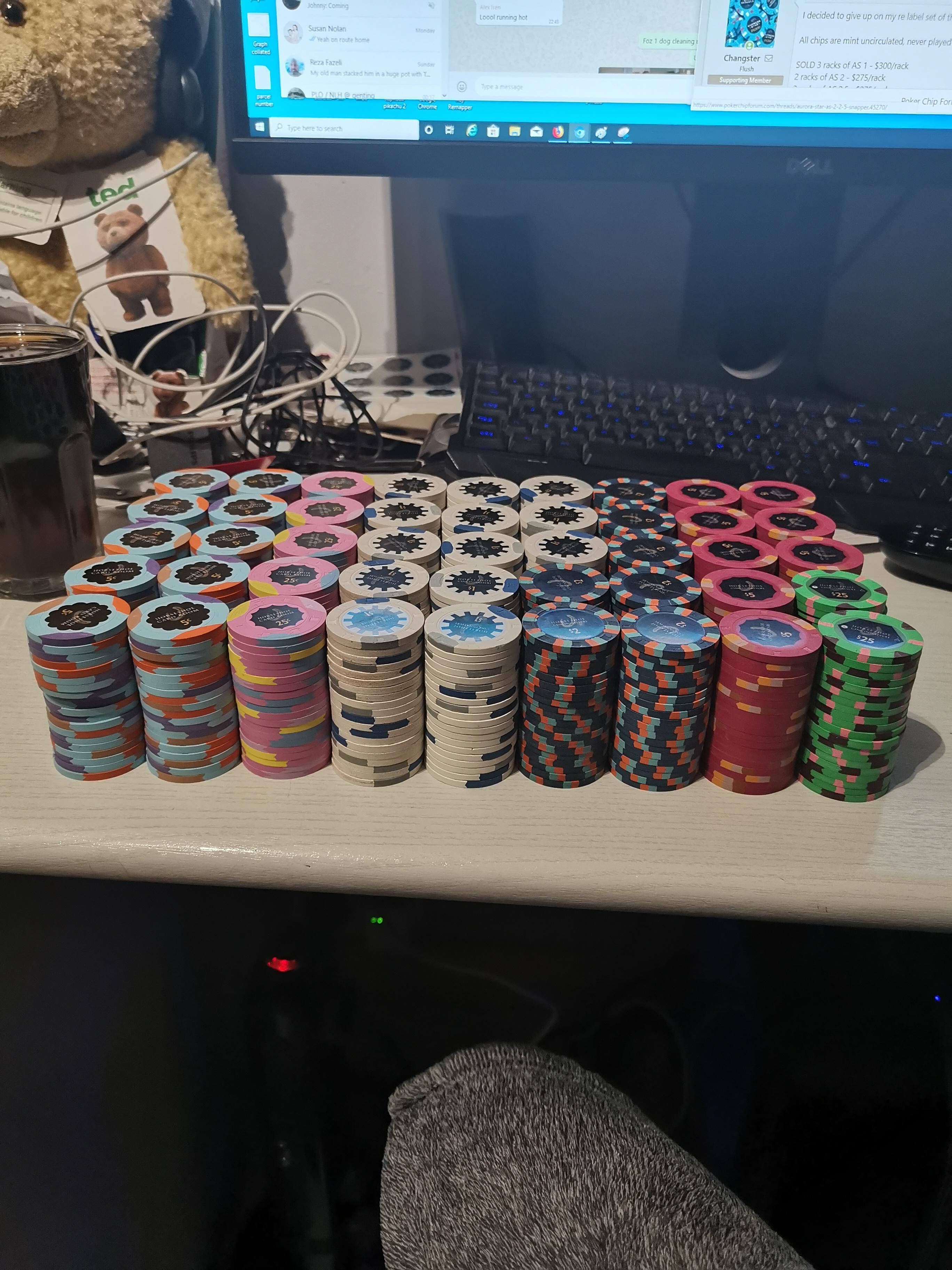 New poker set. Another rack of pink chips are awaiting new labels