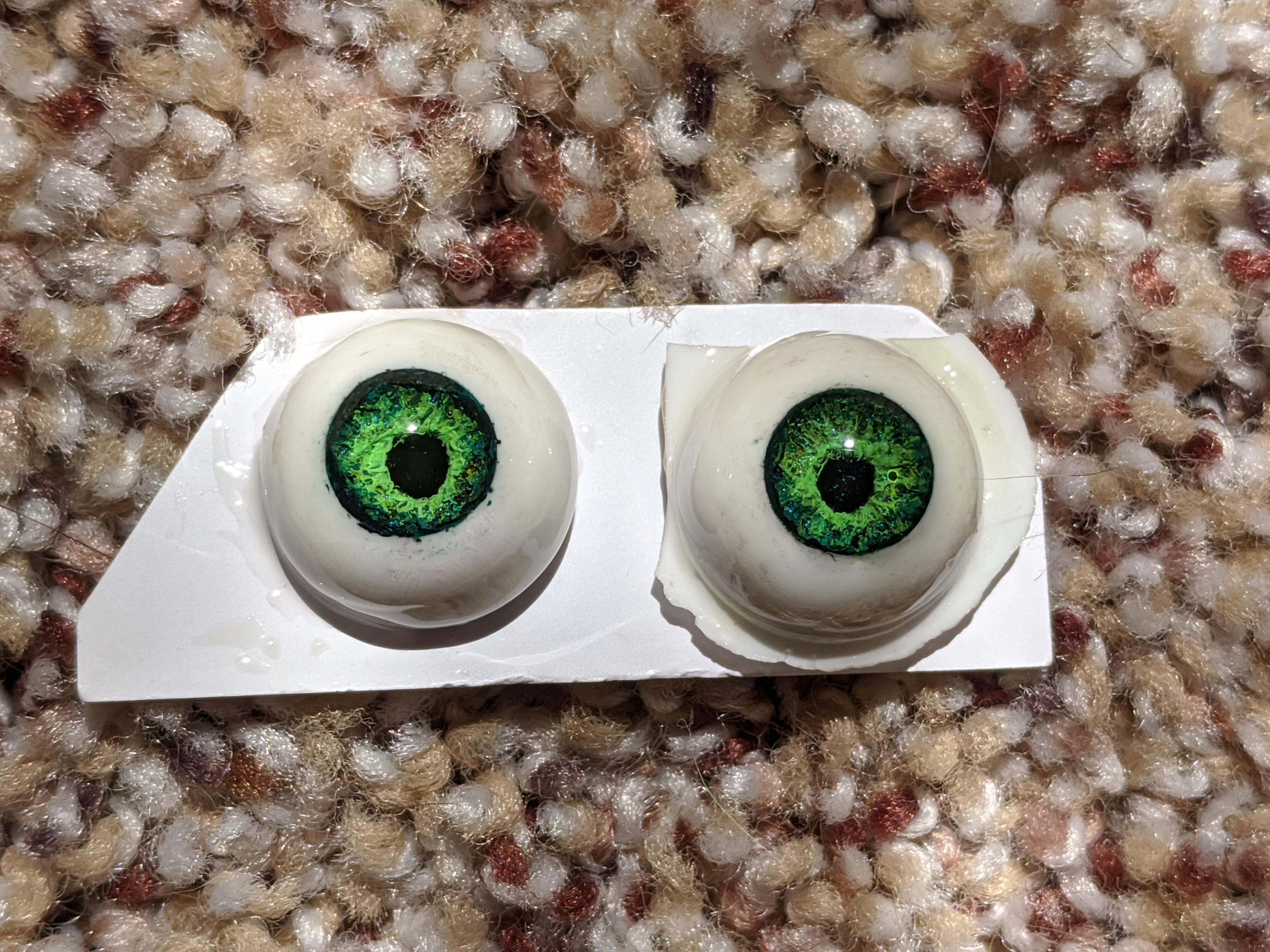 My first DIY resin eyes. attempted to make a "realistic" iris, but i