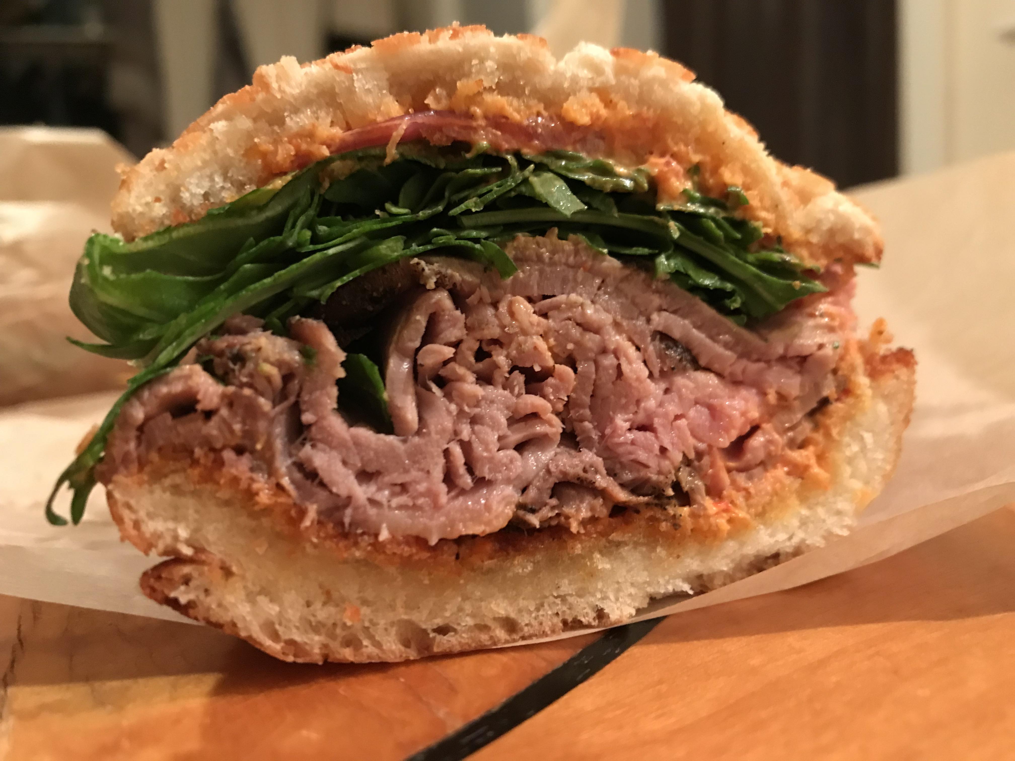 Roast beef, pimento cheese, pickled onions and arugula on dutch crunch