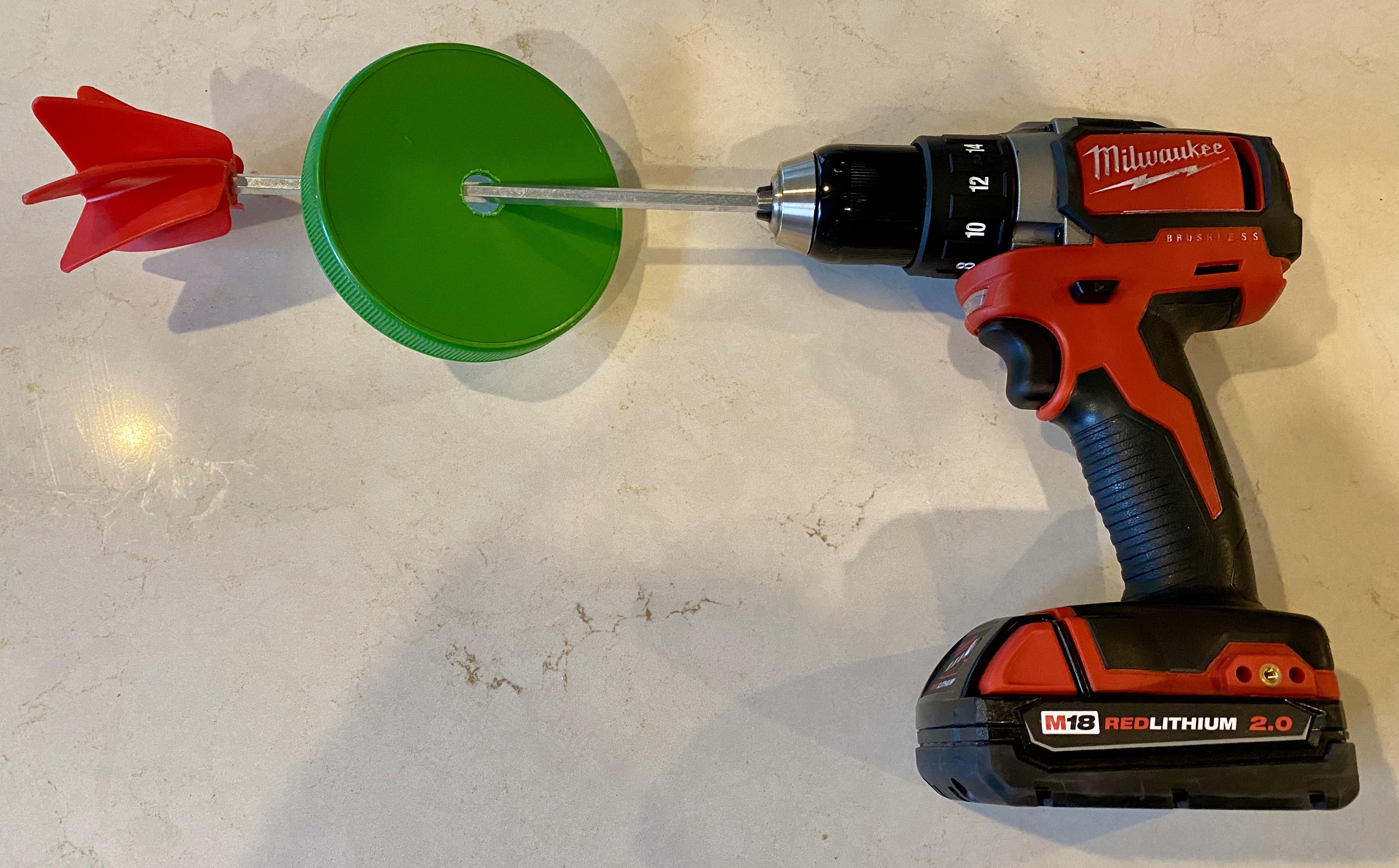 Adams Peanut Butter Stirrer. Old lid with hole drilled + paint mixing