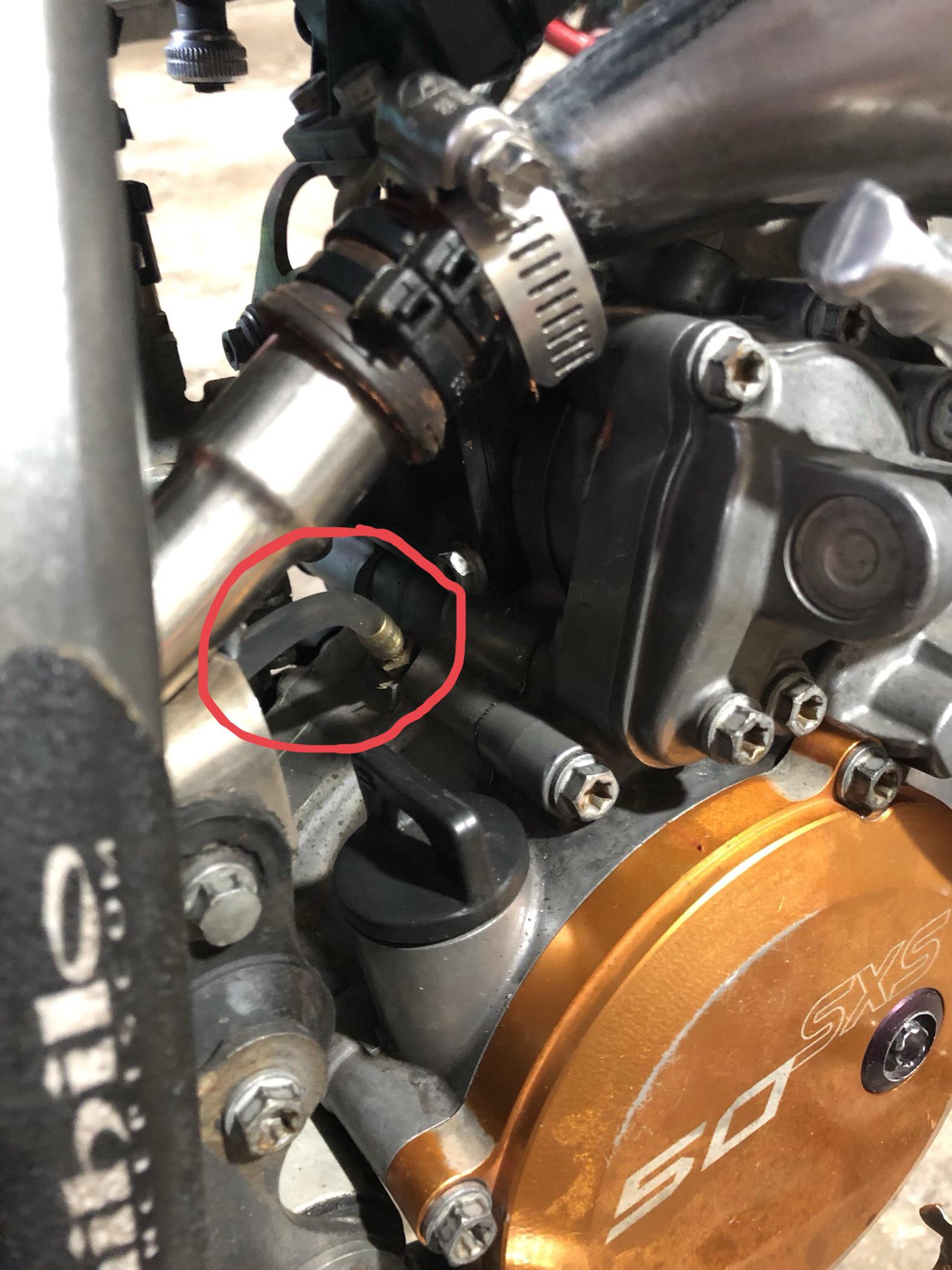 What is coming out of this breather hose on my son’s KTM 50 SX. Looks