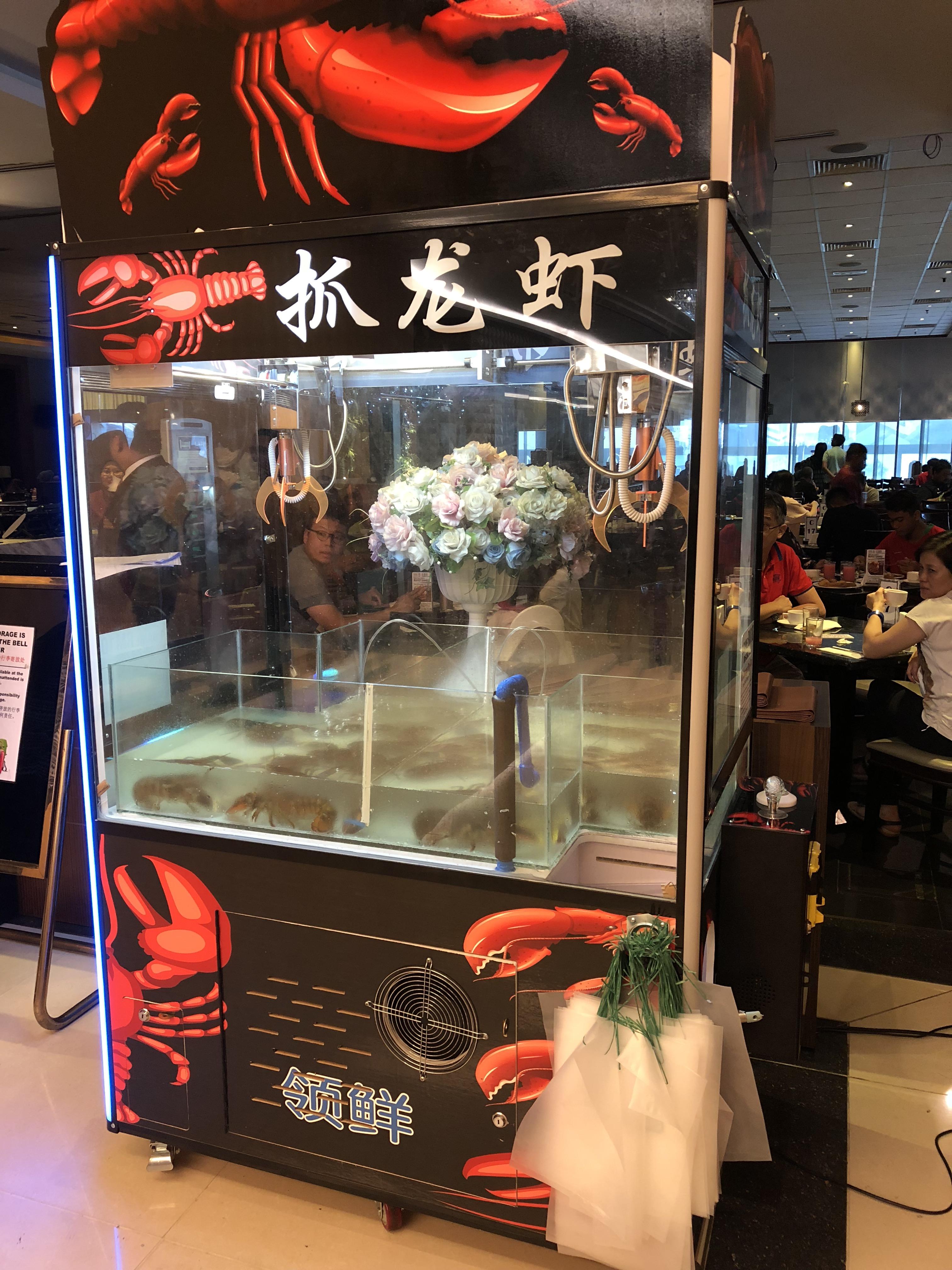 This lobster restaurant that has a live lobster claw machine r