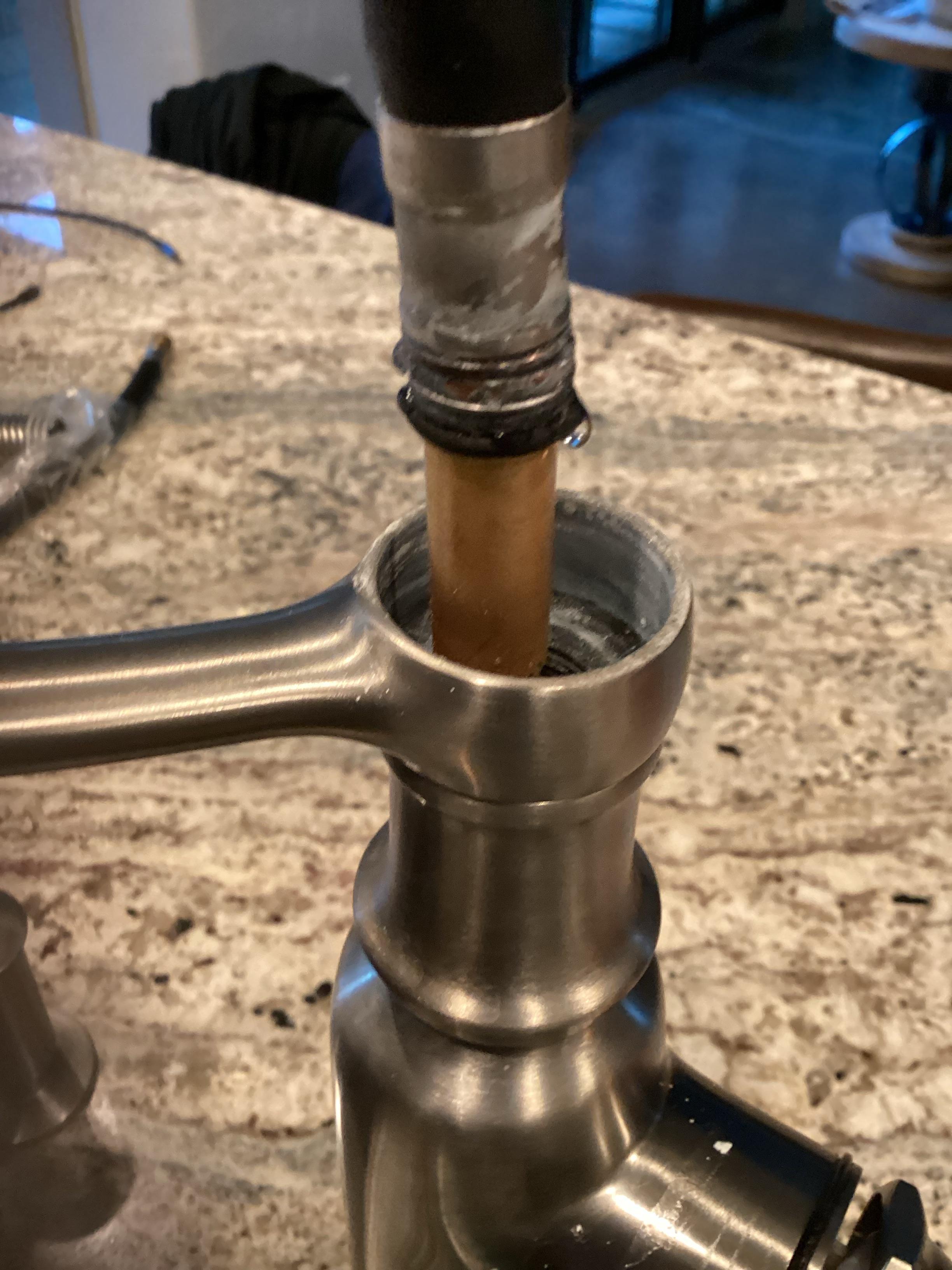 How do you remove this Kohler pull out faucet hose? r/askaplumber