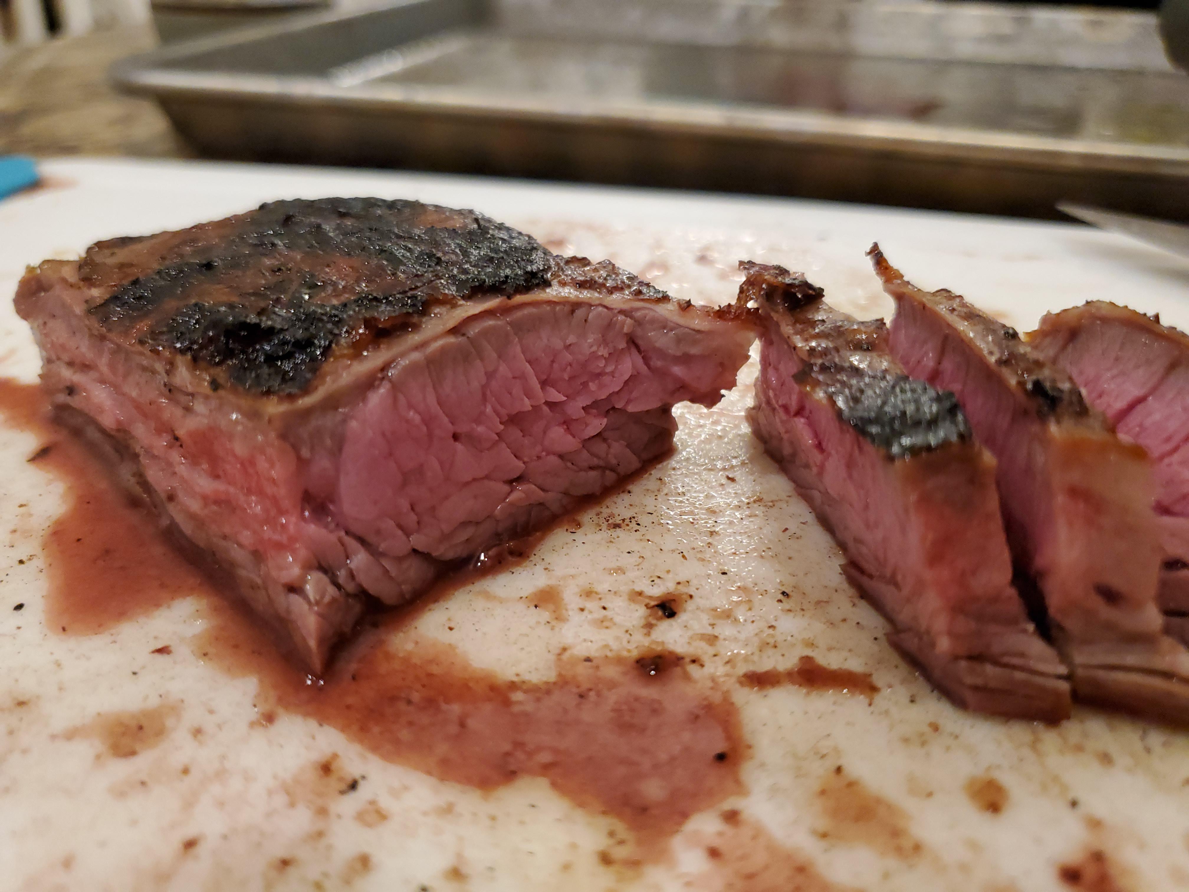 Skirt Steak on the weber, marinaded and warmed over hot coals. r/grilling