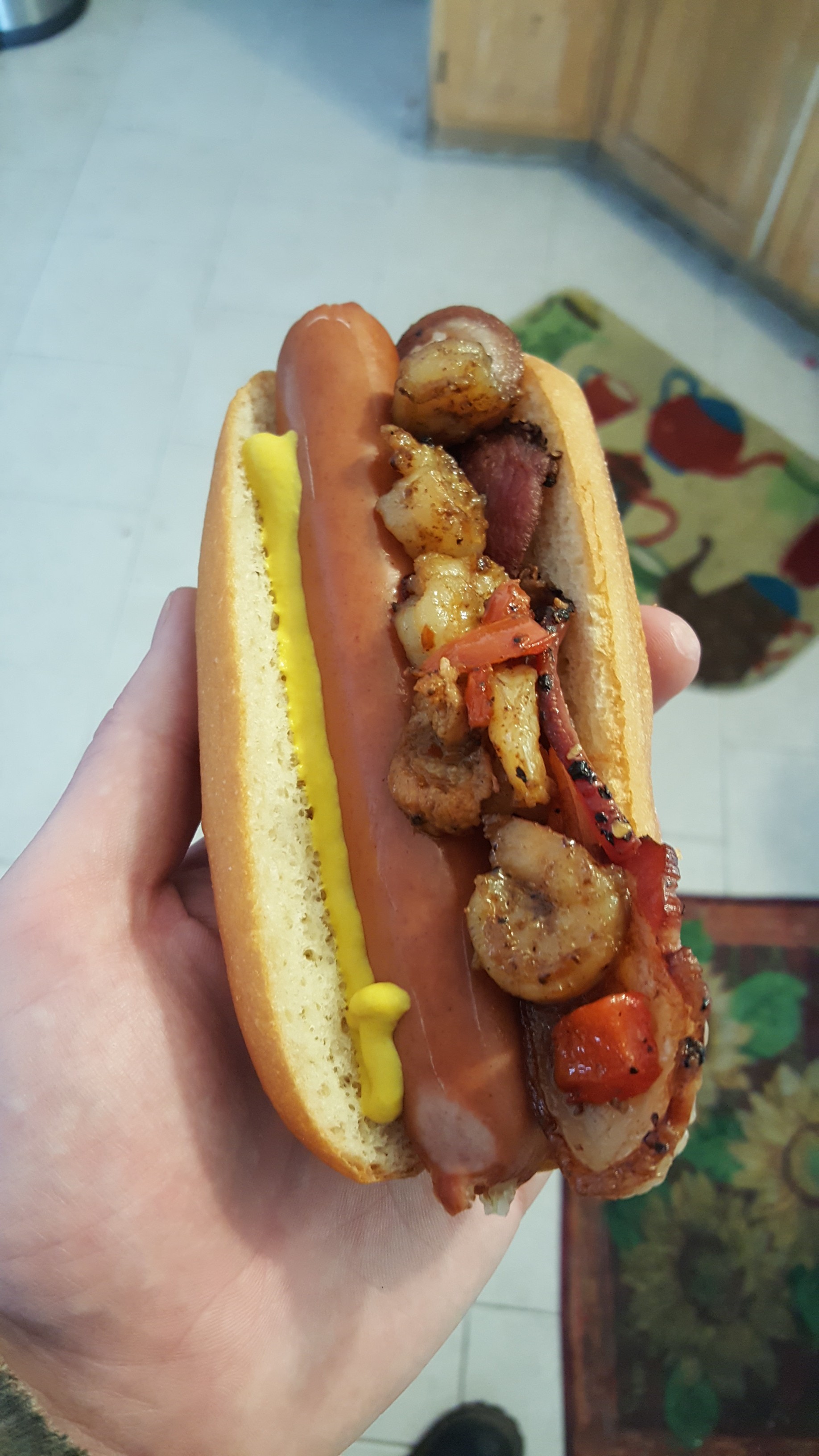 I called this indigestion and shame. Hot dog nested with bacon and topped with leftover cajun