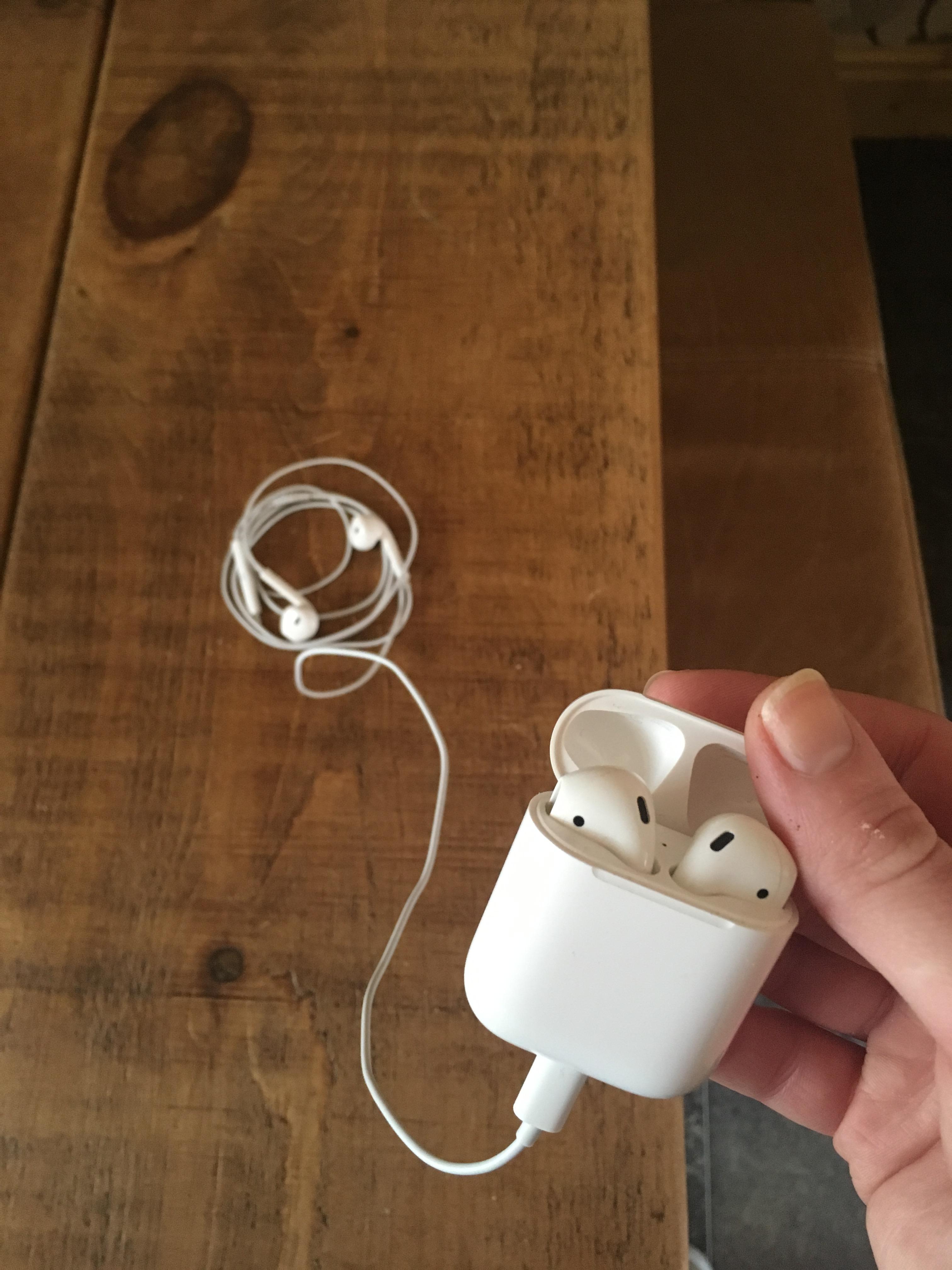 Apple's wired headphones plugged into Apple's wireless headphones r